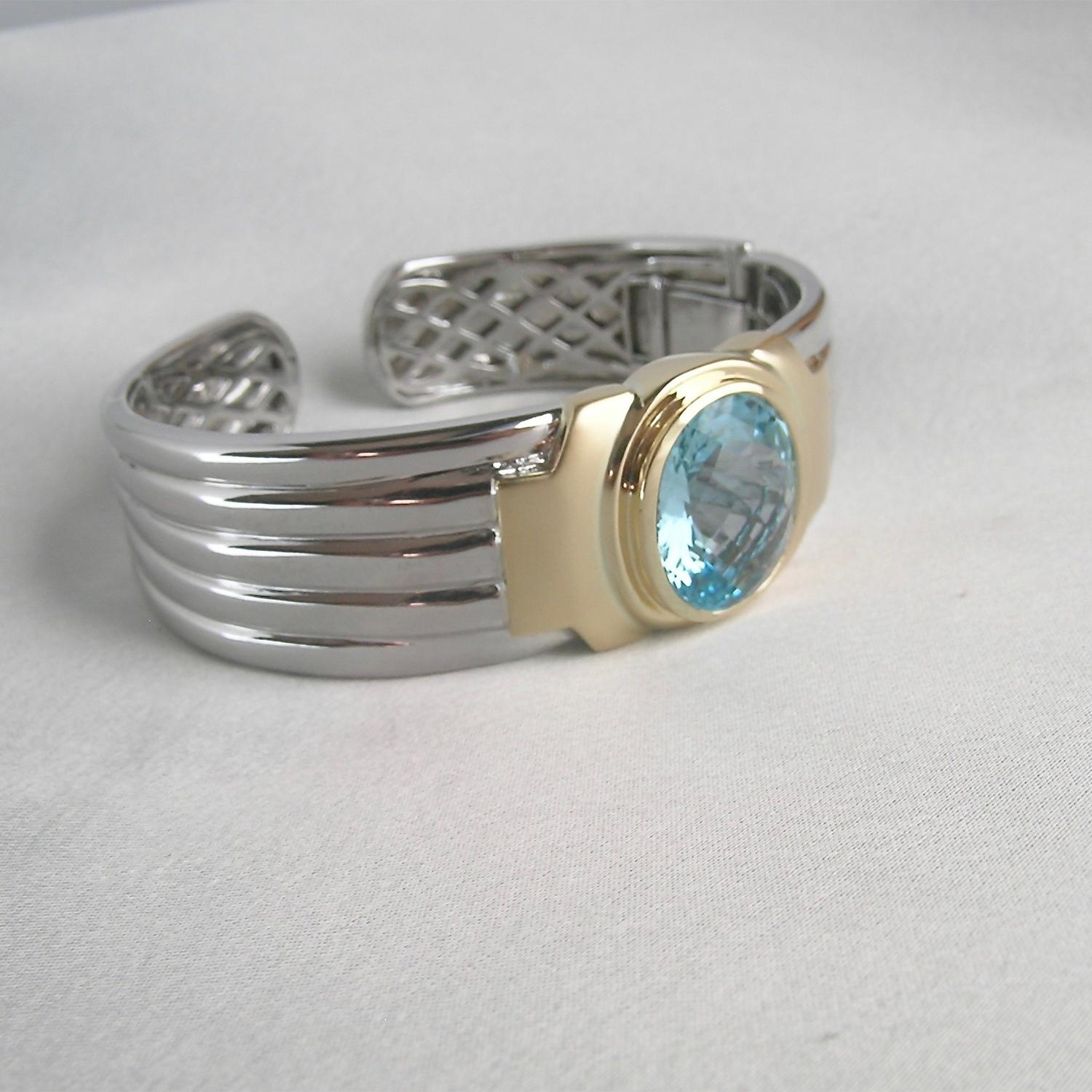 The mixing of silver with gold is a new direction for Nancy.  This beautiful and substantial cuff/bracelet can be worn by a man or woman.  Nancy has often combined white and yellow gold, but using silver gives a similar look at a much different