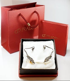 18 Karat Gold and Silver Dragon Cuff Earrings with Diamonds and Yellow Saphires