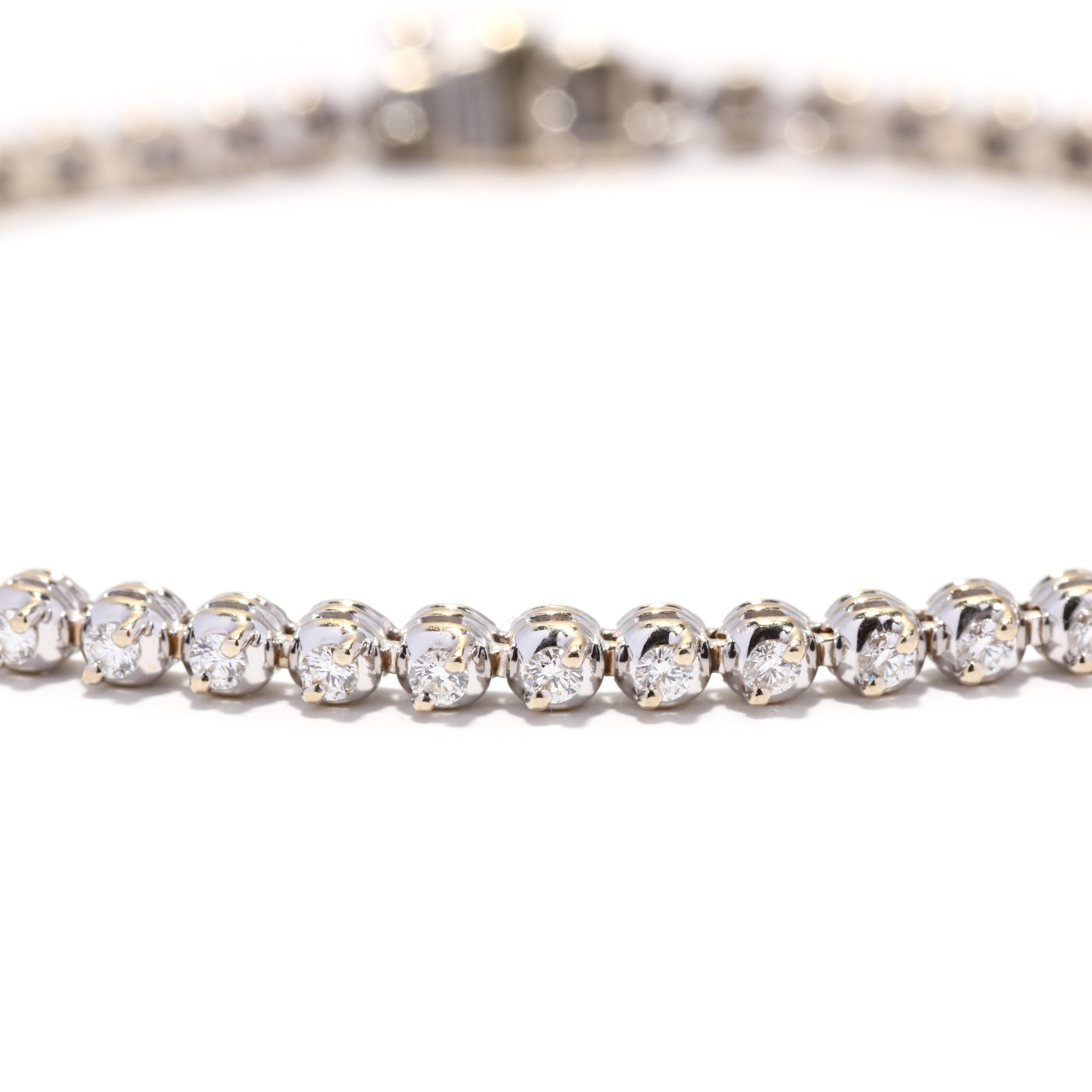A vintage 18 karat white gold diamond tennis bracelet. This thin bracelet features small round links, with prong set full cut round diamonds weighing approximately 1.20 total carats and with a box clasp.

Stones:
- diamonds, 59 stones
- full cut
