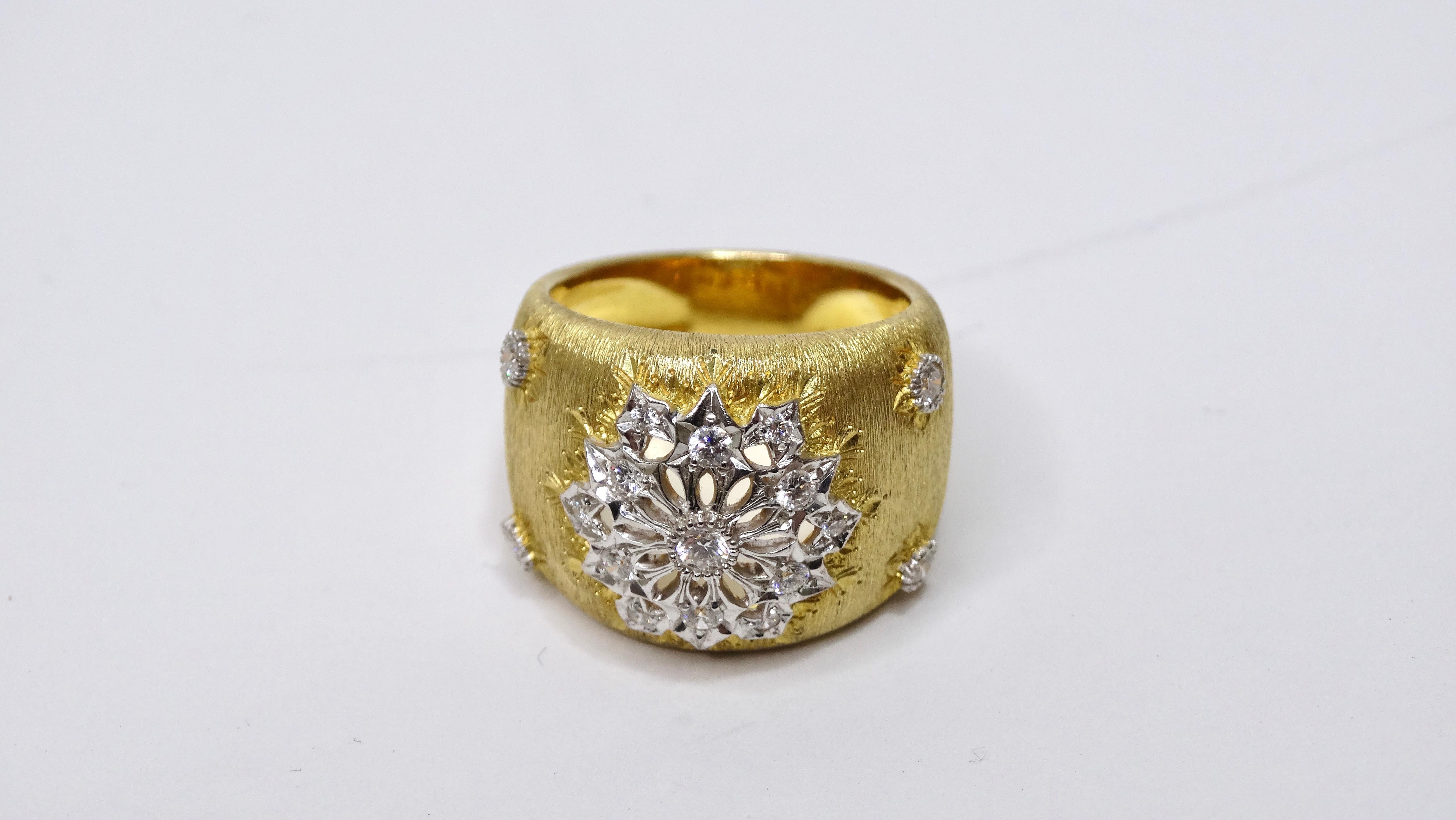This is an exquisite ring that has a highly designed look that is made for a queen! This luxurious ring features a vibrant 18k brushed gold with intricate cutouts with diamonds resembling a flower or a snowflake. It has a chunky band silhouette that