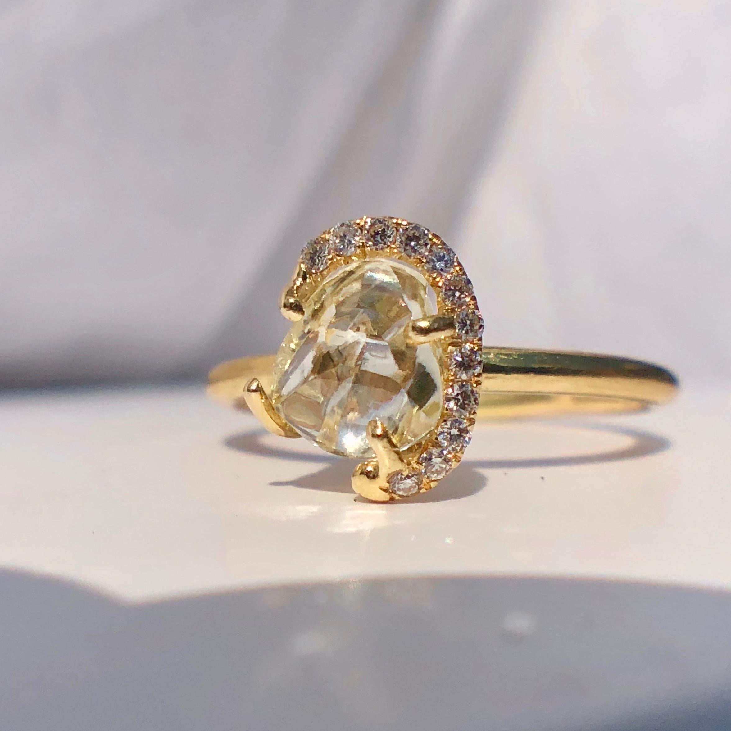 Very Pretty and Wearable Ring From the Wonderful Design Company 'DIAMOND IN THE ROUGH'

An 18 Karat Yellow Gold, Rough Diamond and Diamond Ring by 'Diamond in the Rough' 

A ring containing one rough diamond weighing approximately 1.24 carats and 12