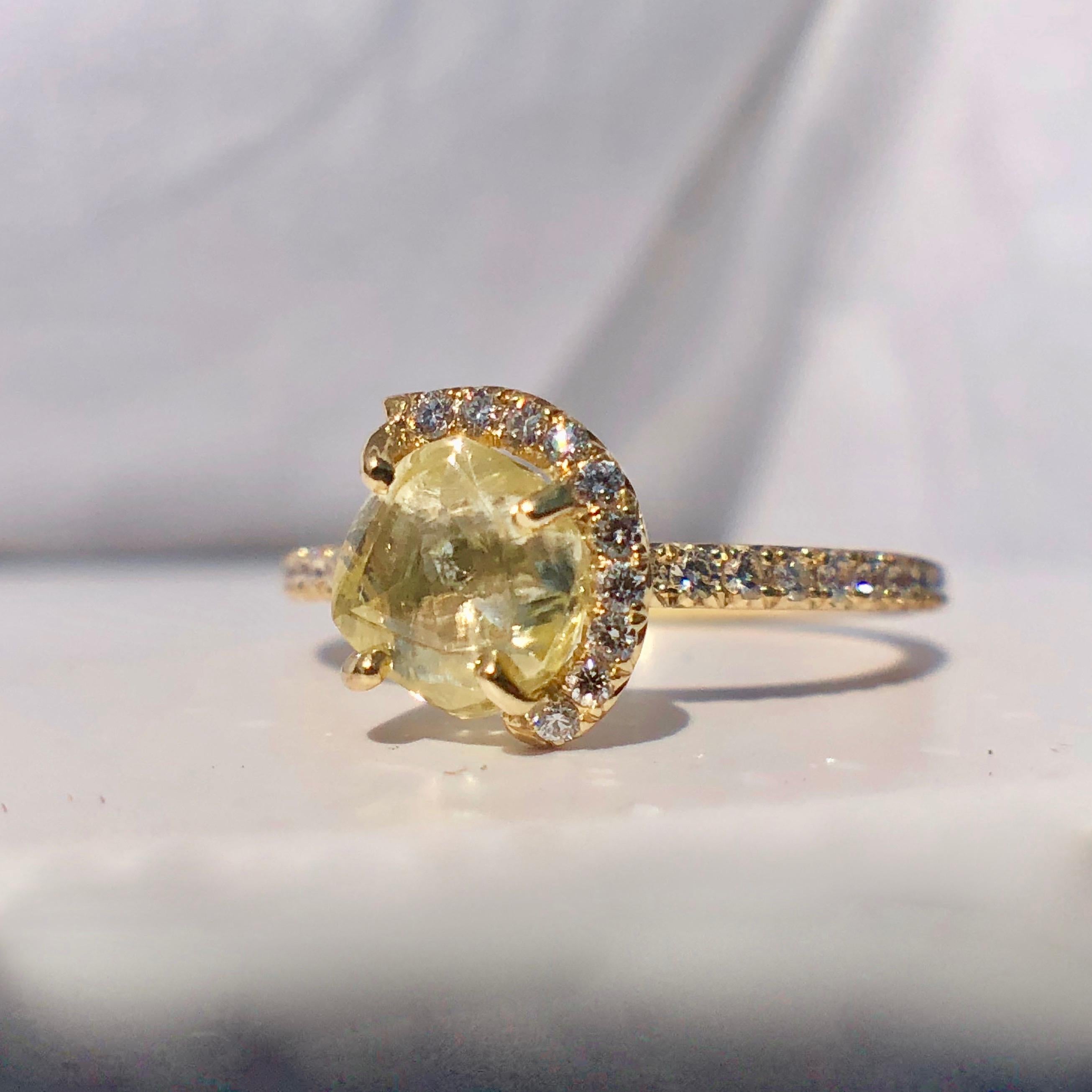 A yellow diamond ring with round brilliant cut halo and shoulders by the company 'diamonds in the rough' 

Based on current similar items sold by the company we recommend insuring this piece for $10,000
Rough diamonds are revered for their pure,
