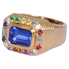 Anillo de oro de 18 quilates de tanzanita con zafiros y diamantes