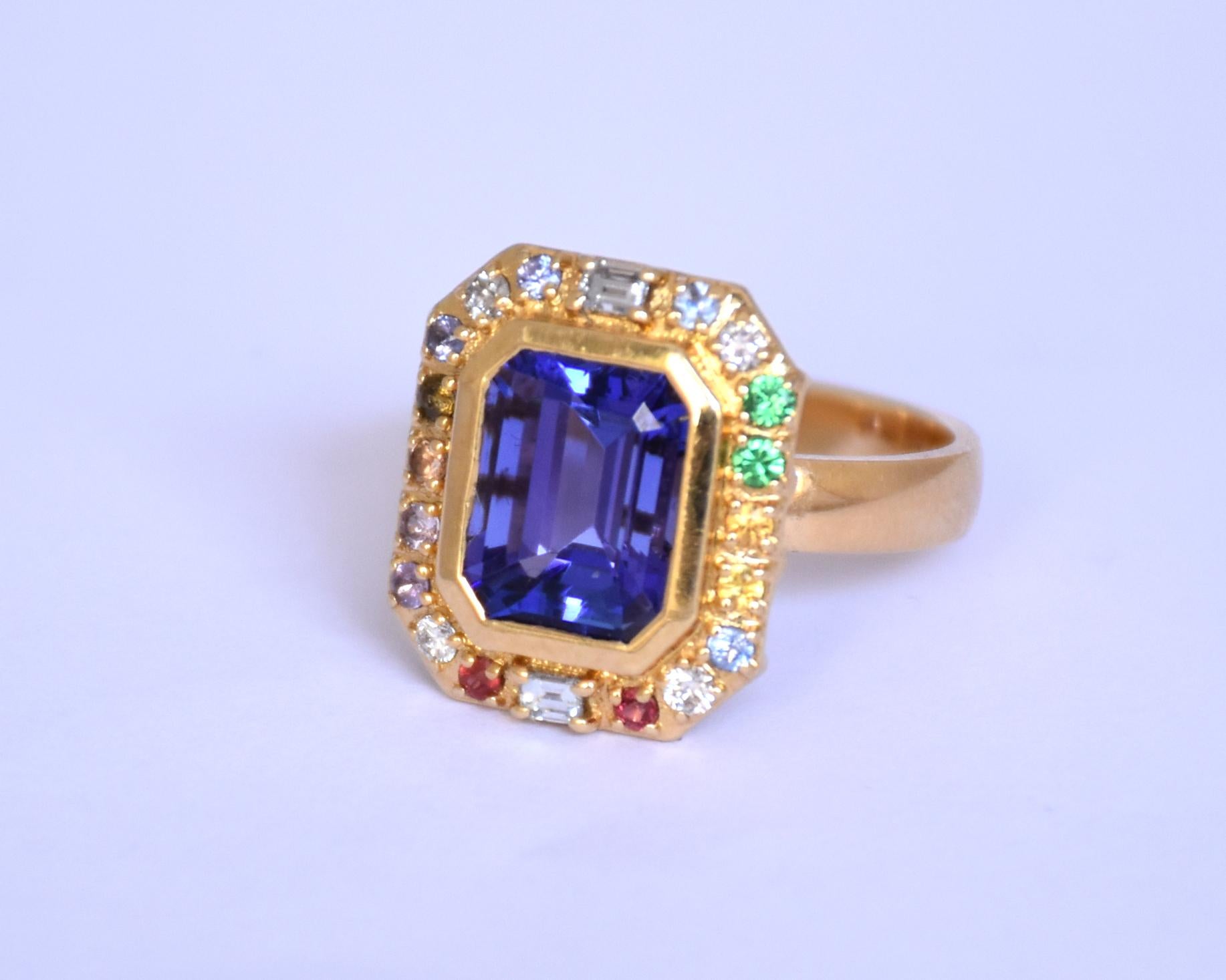 Emerald Cut 18K gold Tanzanite titanic stone ring with multi sapphires and diamonds