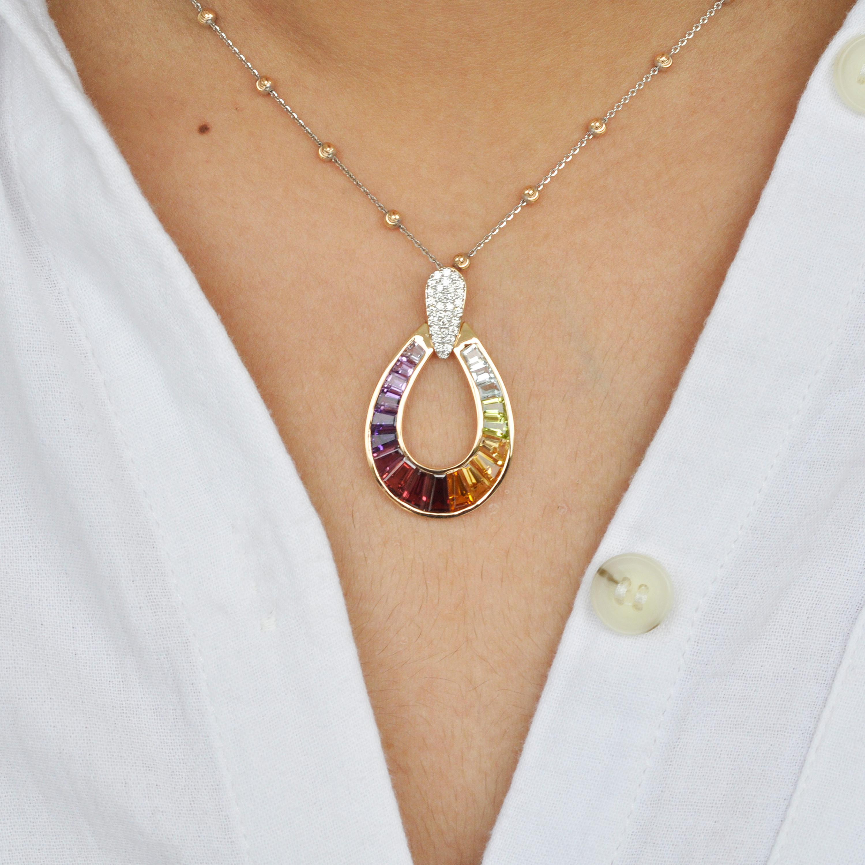 Elevate your style with the exquisite beauty of this 18K gold taper baguette multi-color raindrop-shaped rainbow pendant necklace. This stunning pendant features a large and delicate drop, gracefully adorned with a dazzling array of gemstones that