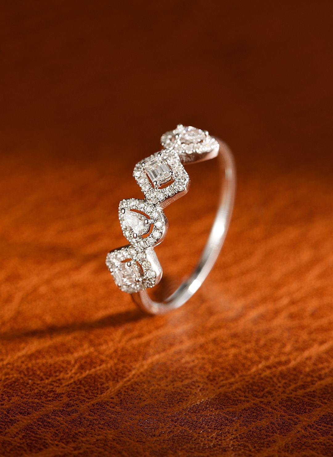 A masterpiece of nature-inspired luxury, 18K gold ring featuring a vibrant emerald-cut natural emerald (0.10ct) at its center, accented by 0.37ct of brilliant natural diamonds. The delicate design exudes elegance and sophistication, making it an