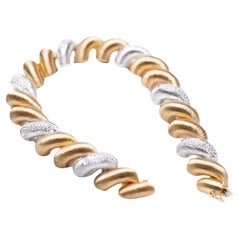 Telefonspulenarmband aus 18K Gold mit Diamanten