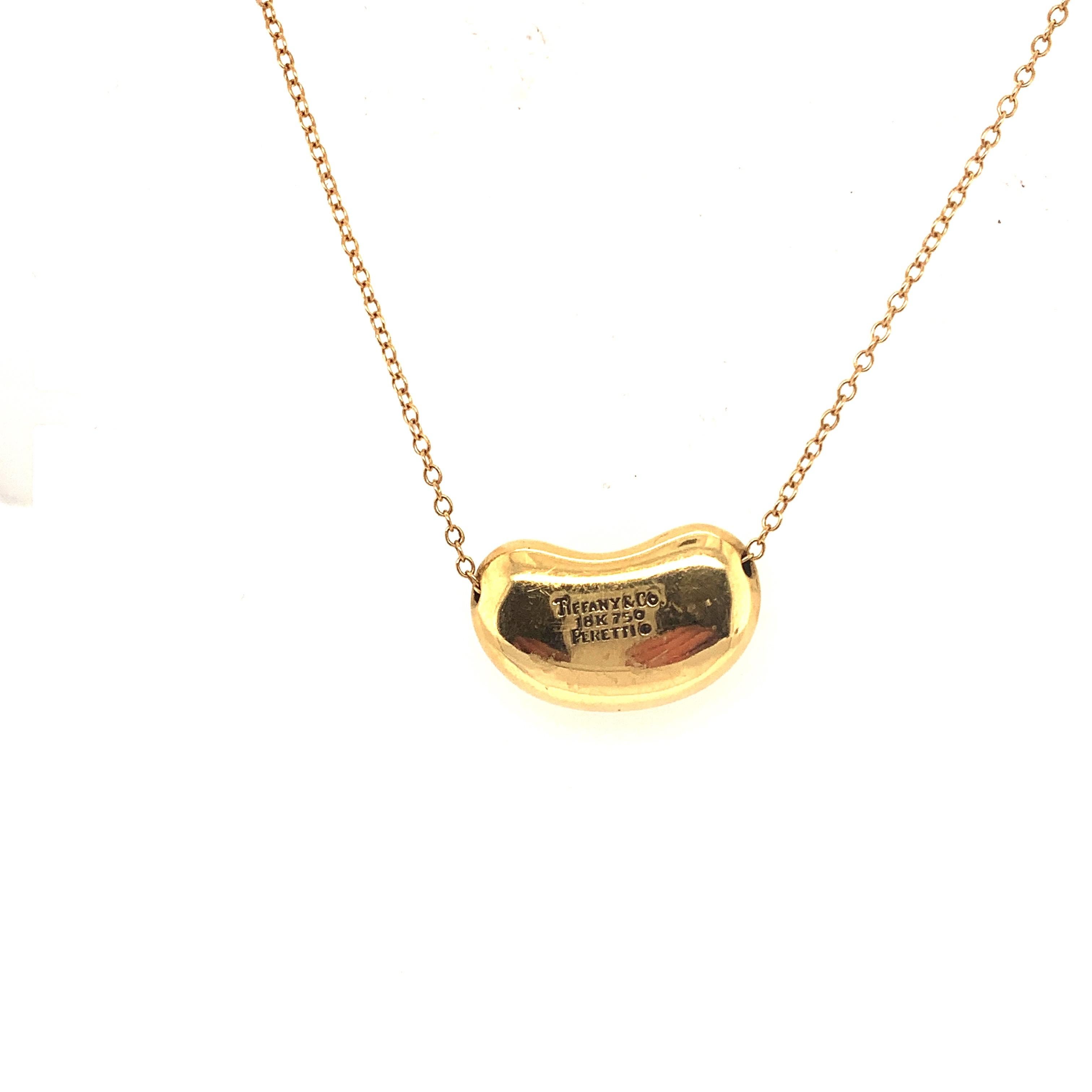 Super large Bean. From the famous Tiffany and Co. designer Elsa Peretti  Bean. This iconic Bean represents all things Tiffany.
Weighing over 18 grams of solid 18k Gold, this ones a showstopper.
Chain and bean stamped Peretti Tiffany.

All items sold