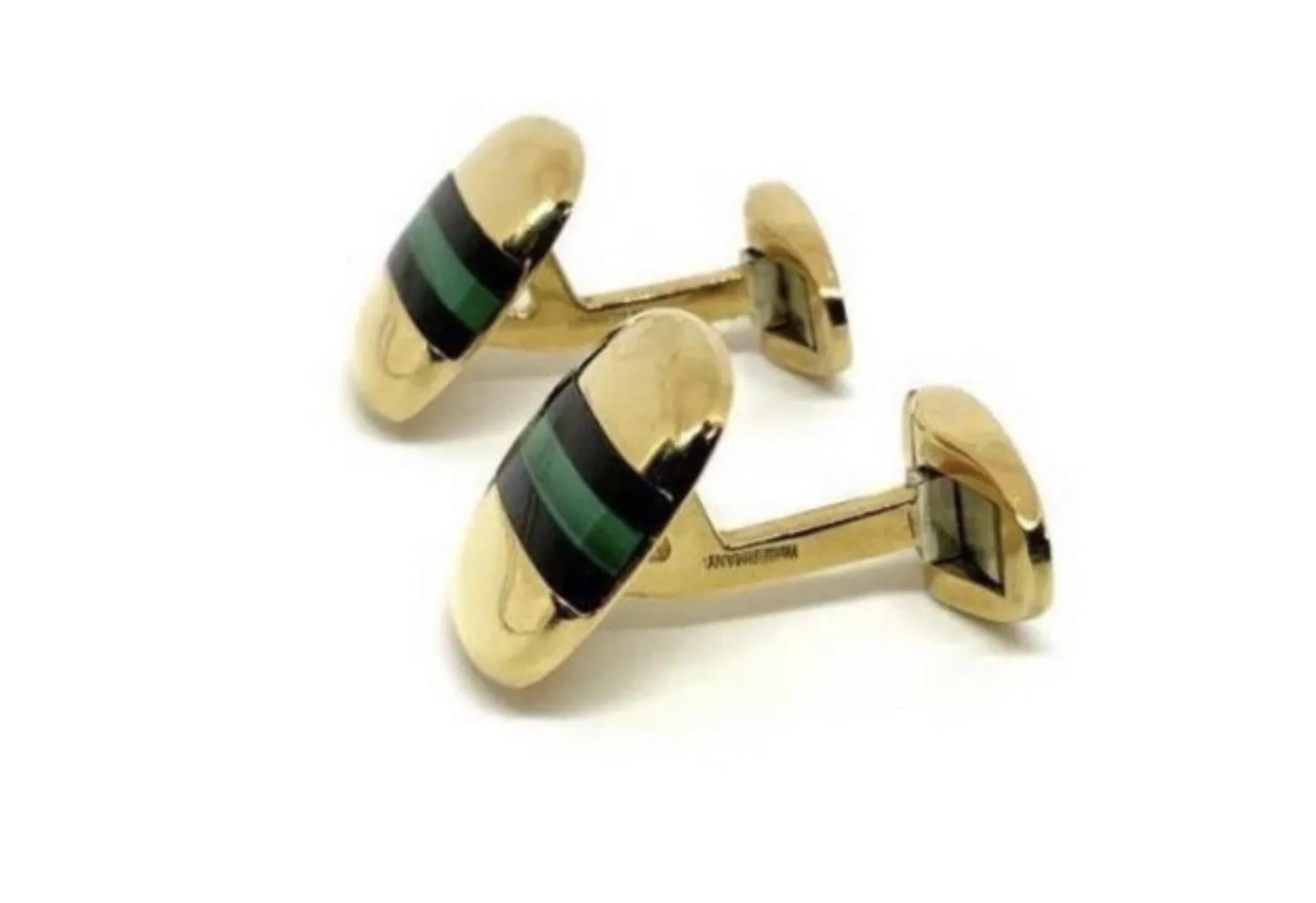 Stunning pair of 18k gold Tiffany & Co. cuff links inset with Malachite & Black Onyx. Signed “18ct - Tiffany & Co. - W-Germany”.  These measure 5/8” by 9/16” & weigh 16.5g. They come in a Tiffany & Co. Holder.


Authenticity Guarantee: All of our