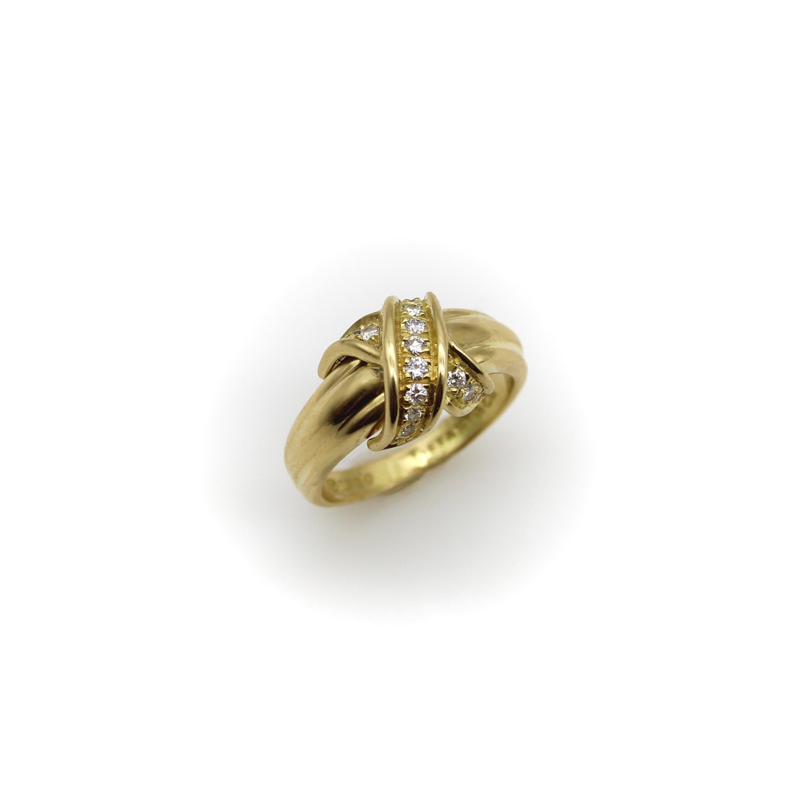 Tiffany & Co.’s signature classic “X” ring was designed by Jean Schlumberger, who famously described his aesthetic by saying “I try to make everything look as if it were growing, uneven, at random, organic, in motion.” In this 18k gold ring, a