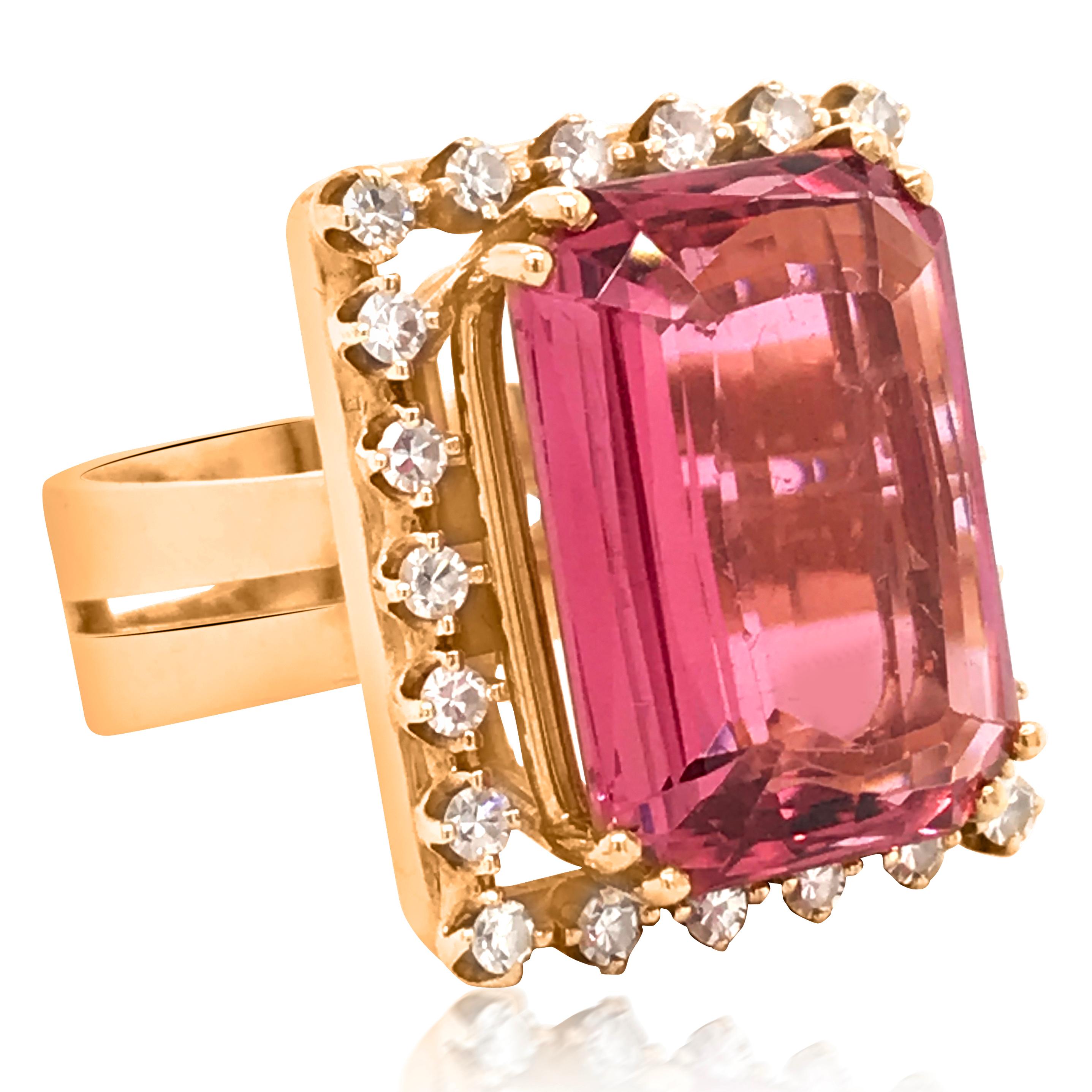 This irresistible pink tourmaline ring is designed by PAASH crafted in 18K yellow gold. It is centered with a cushion-cut genuine pink tourmaline measuring 17.40 x 12.70 x 6.65 mm and weighing approx 11.5ct. Surrounded by 22 prong-set round-cut