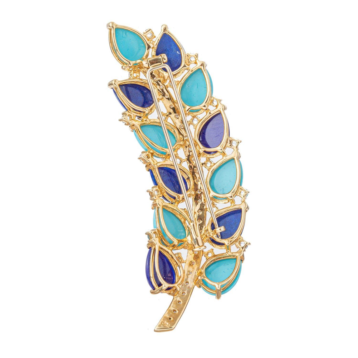 Leaf pin in 18k yellow gold, featuring larger pear-shaped cabochon turquoise and lapis interspersed with round-cut aquamarine accents, the stem of the leaf set with round brilliant-cut diamonds.  26 round brilliant-cut diamonds weighing