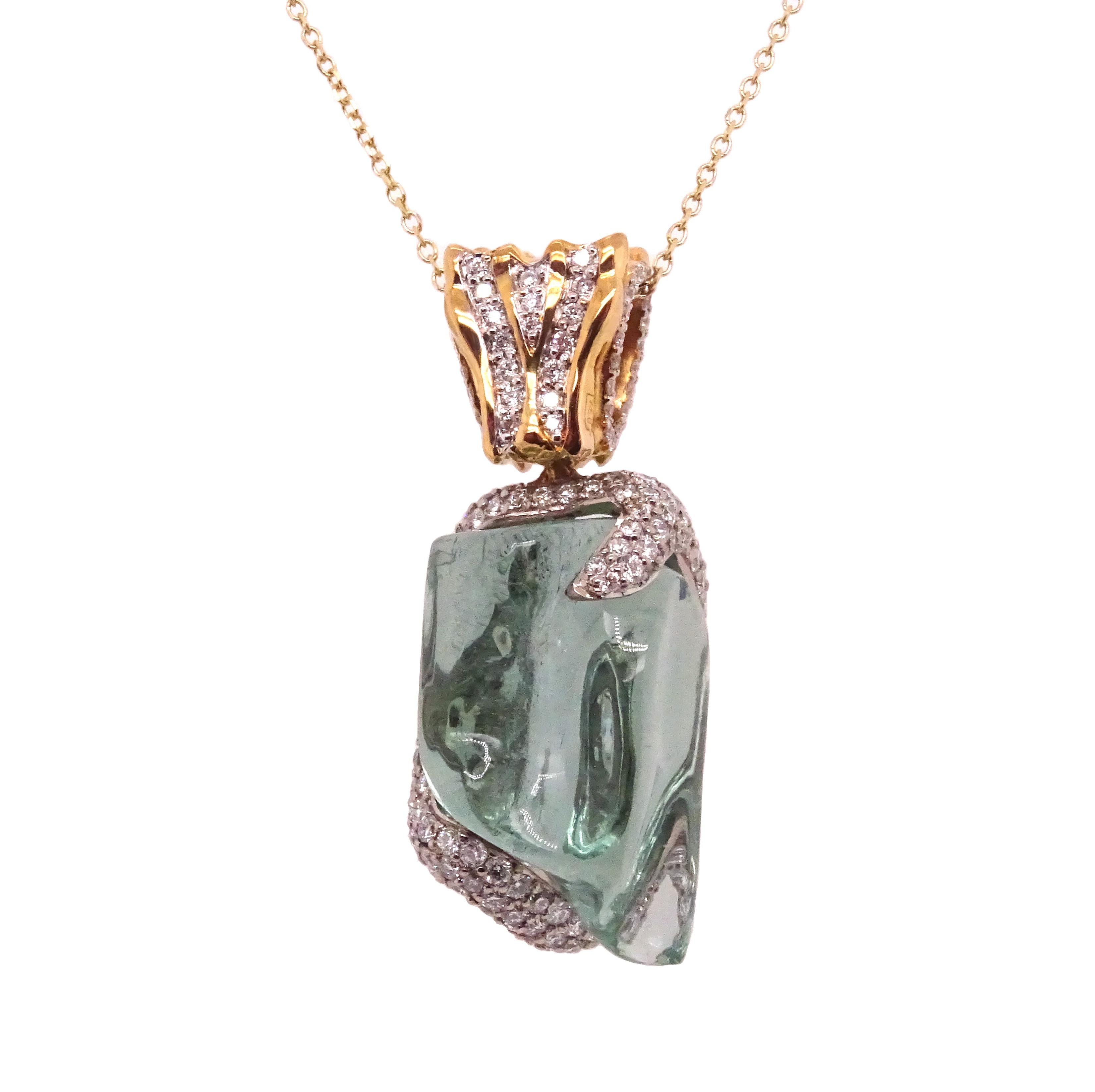Organic collection by VOTIVE.

Discover the enchanting beauty of VOTIVE's Organic Collection, featuring a mesmerizing 18K yellow gold pendant adorned with brilliant white diamonds and a captivating uncut aquamarine gemstone. The organic allure of