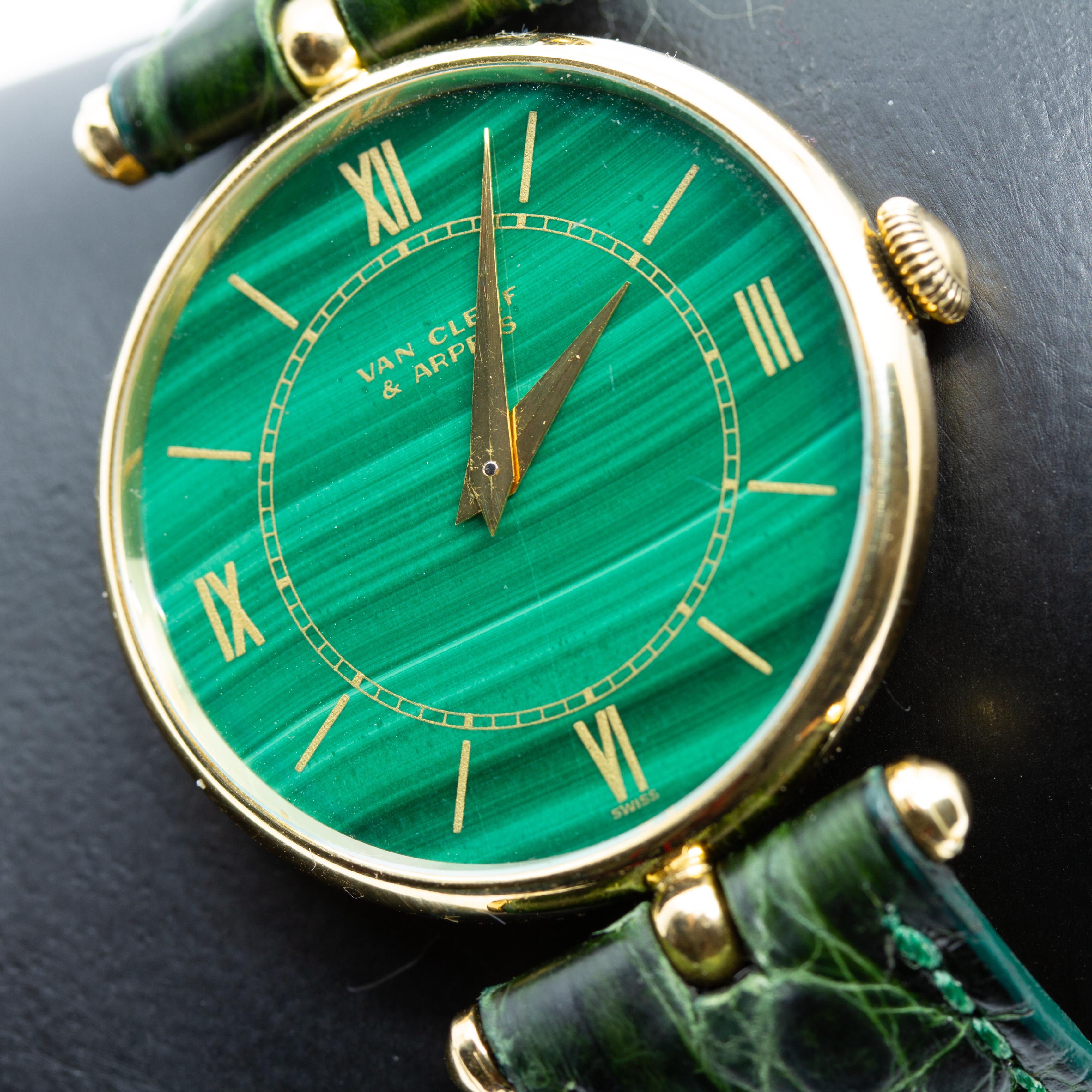 Van Cleef & Arpels 18K Yellow Gold Wristwatch With Malachite Dial. Offered is a authentic 18K gold Van Cleef and Arpels 17 jewel stem wind wristwatch. The watch has a Genuine Crocodile Band 16R Made in USA. The watch is signed on the face and on the