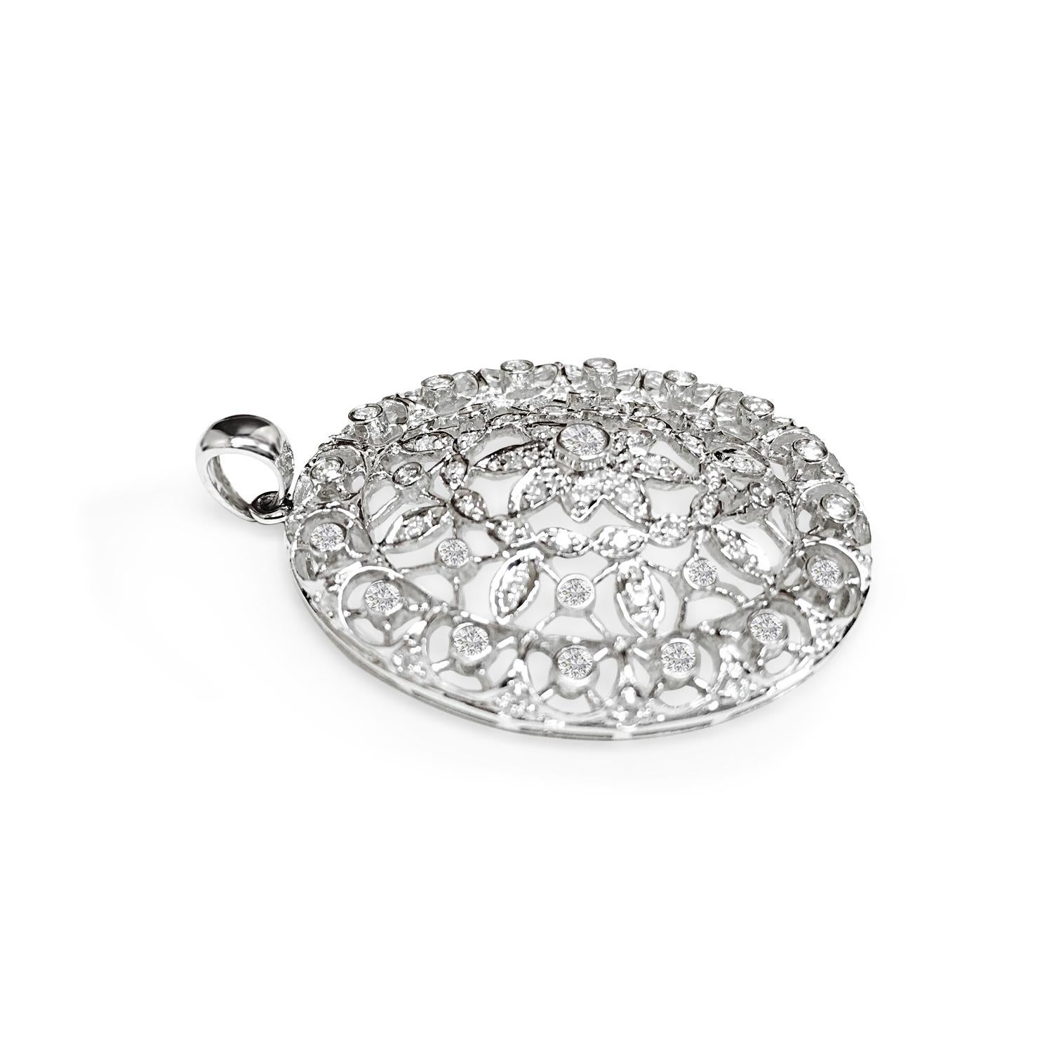 Vintage elegance meets modern sophistication in this 18k white gold pendant adorned with 1.50 carats of round brilliant cut diamonds, boasting VS clarity and F color. Each diamond is meticulously earth mined and exhibits exceptional cut and polish.