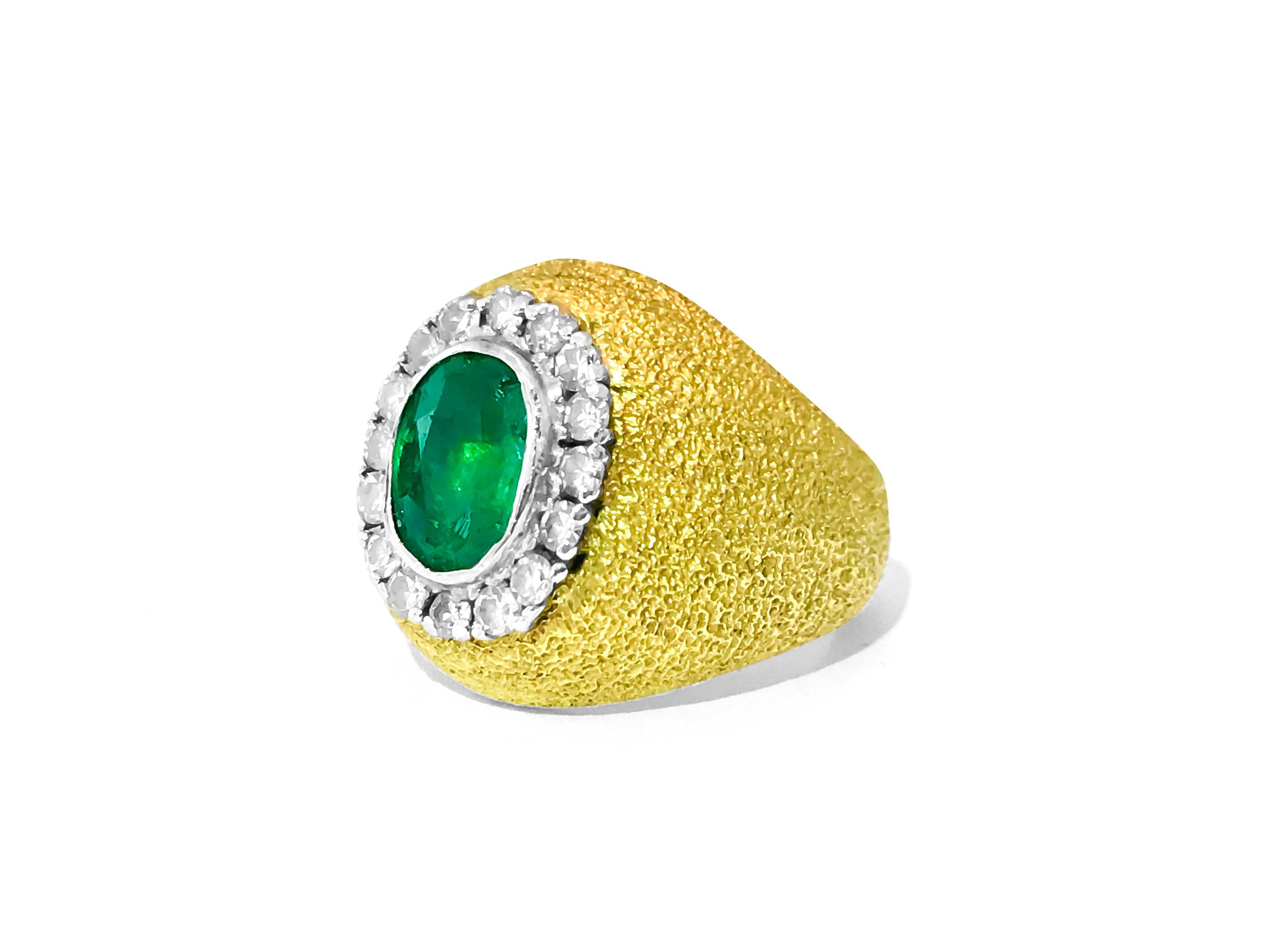 Crafted with 18k yellow gold, this vintage mogul style ring features a stunning oval-shaped Colombian emerald weighing 2.5 carats. The emerald showcases intense green color and exceptional luster, complemented by F color and VS clarity diamonds