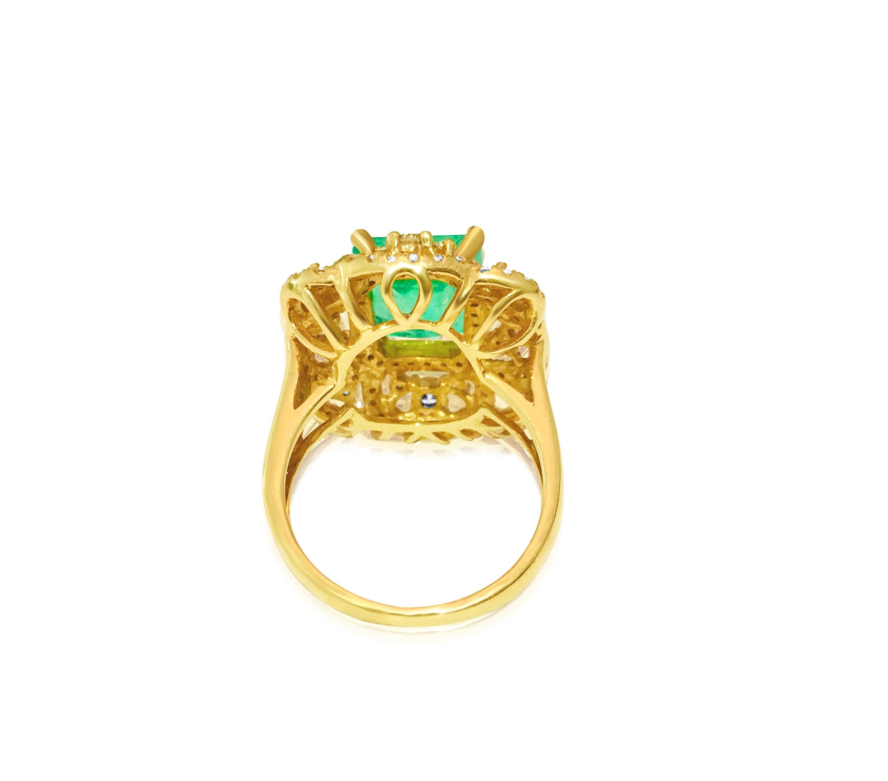 Behold this exquisite 18K yellow gold ring, adorned with a mesmerizing 4.50-carat Colombian emerald, measuring 8.95 x 8.59mm, and showcasing the rich green hue that defines Colombian emeralds. Embracing the emerald are 1.50 carats of diamonds,
