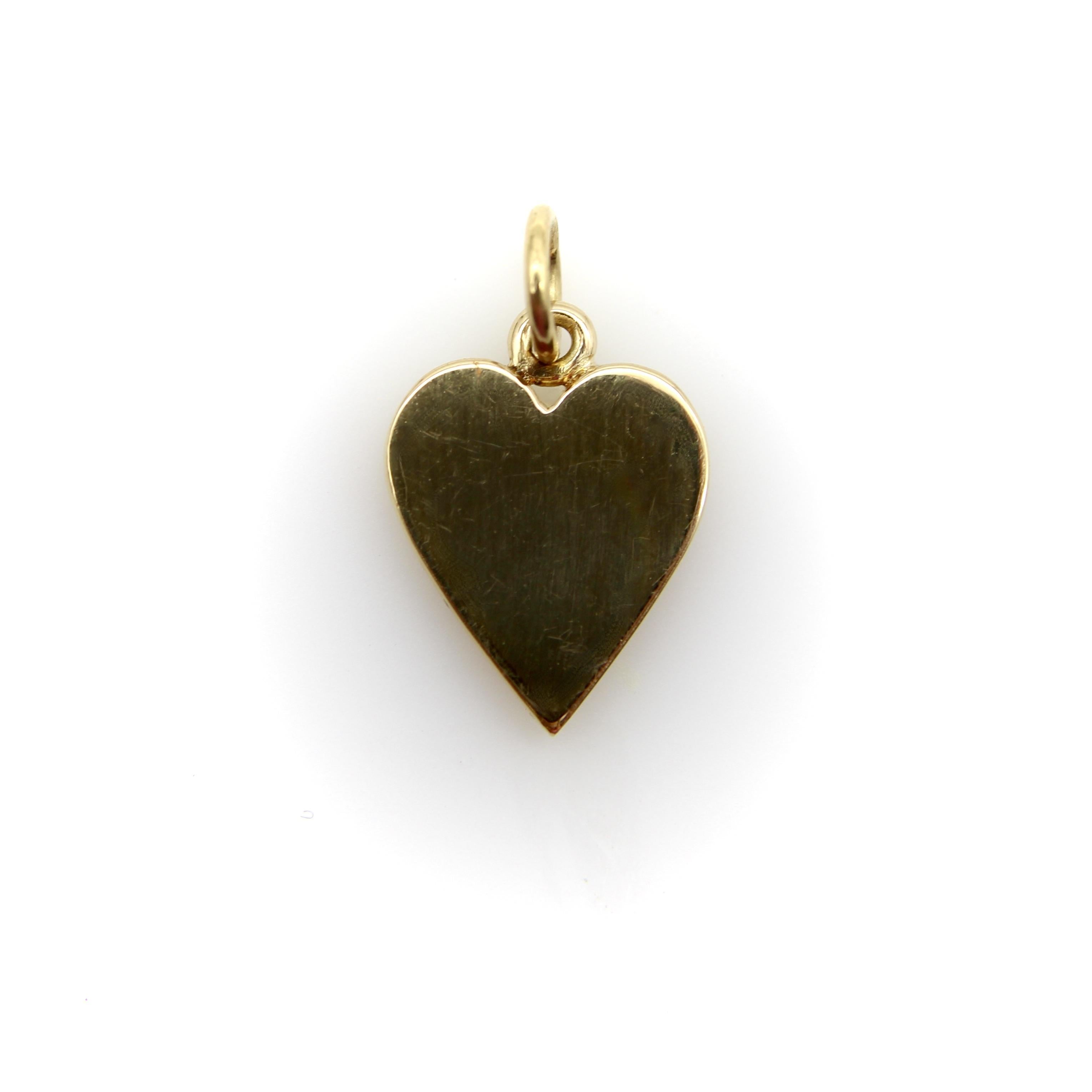 Originally part of a set of cufflinks, this 18k gold heart-shaped pendant has been masterfully transformed into a lucky charm. Our jeweler added a bail and jump ring, and preserved the pendant’s pristine high-polish so that the piece seems to have
