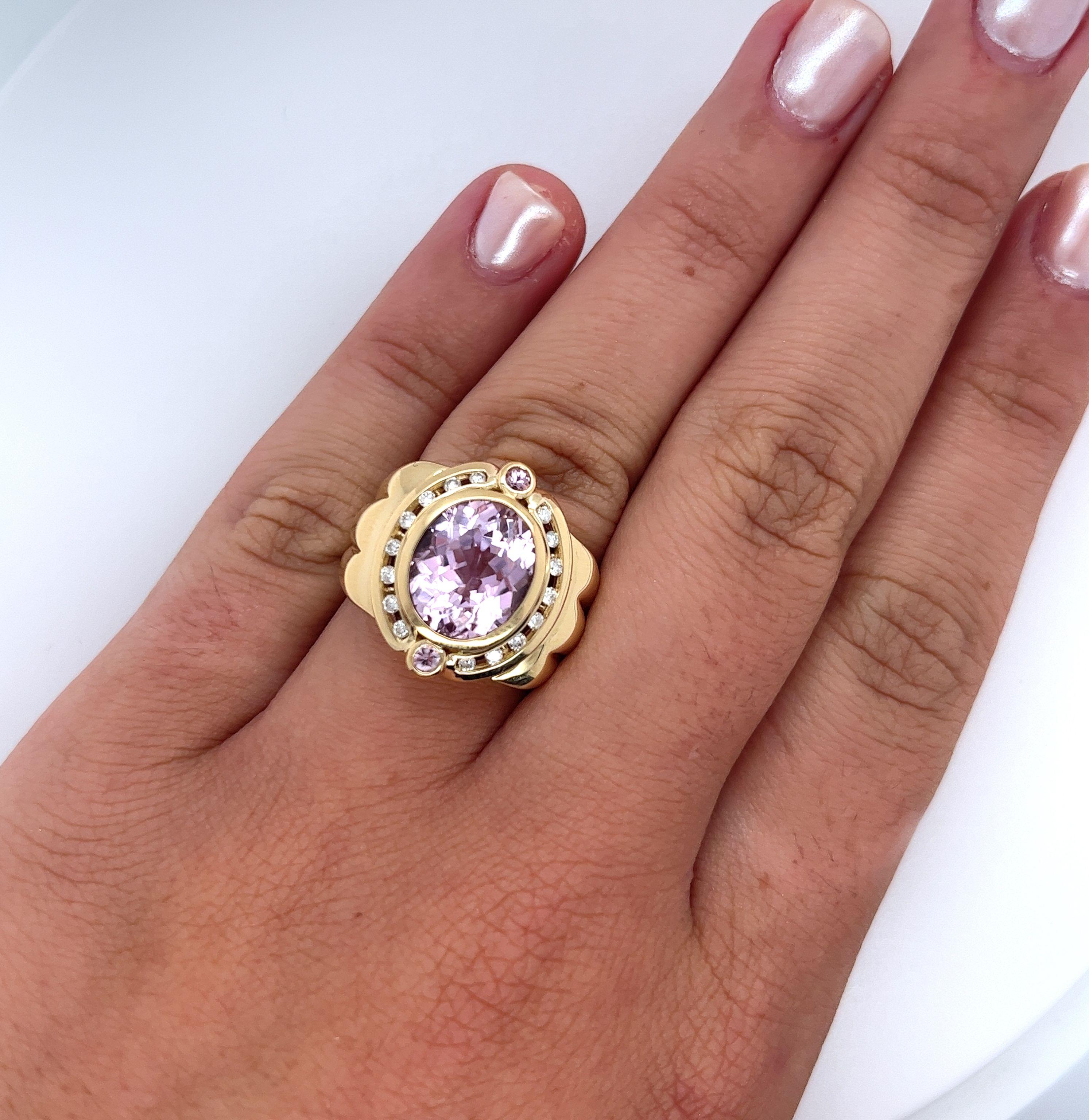 Vintage 6.50 Carat Oval Cut Pink Kunzite and Diamond Ring. Fashioned in 18K Yellow Gold, this semi-precious gem is a tribute to the past, weighing 17.1 grams and offering a regal/retro look. Its intricate setting combines the beauty of channel and