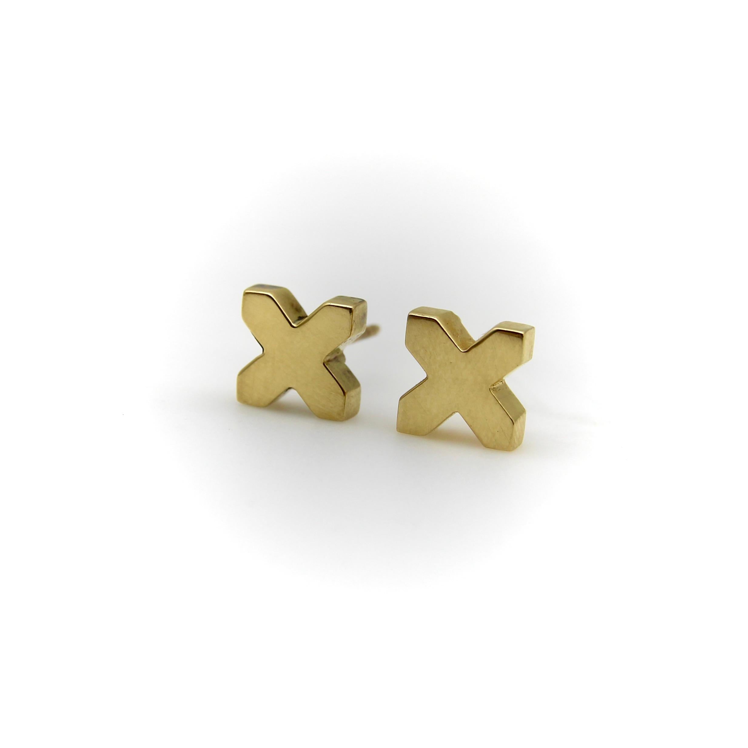 Tiffany & Co. has used the X as one of their signature design elements for decades. This pair is another version of the many stylized X’s in the Tiffany lexicon. We like them because of their blocky three-dimensionality and references to pop