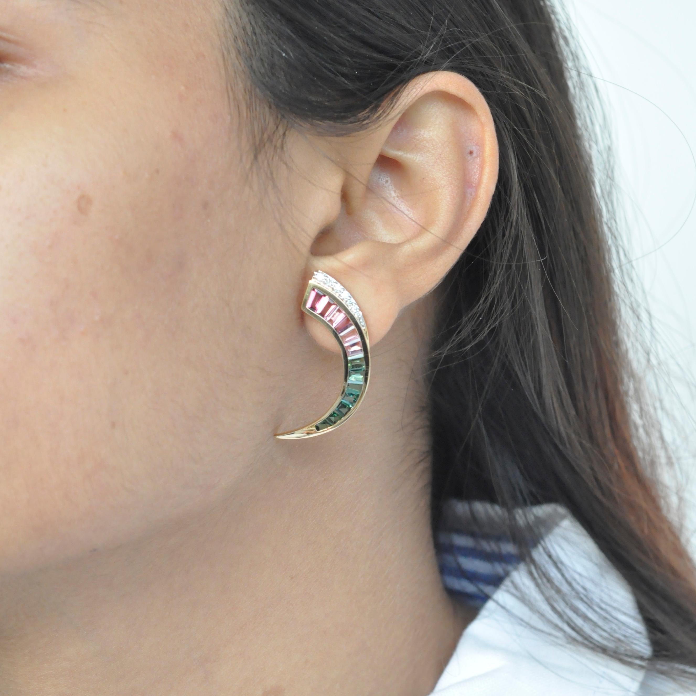 Extremely modernist, extremely edgy - these one-of-a-kind bitourmaline drop earrings are magnificent. Hand picked selection of lustrous green and pink tourmalines are taper cut in colour gradation and channel set with perfection. The slight touch of