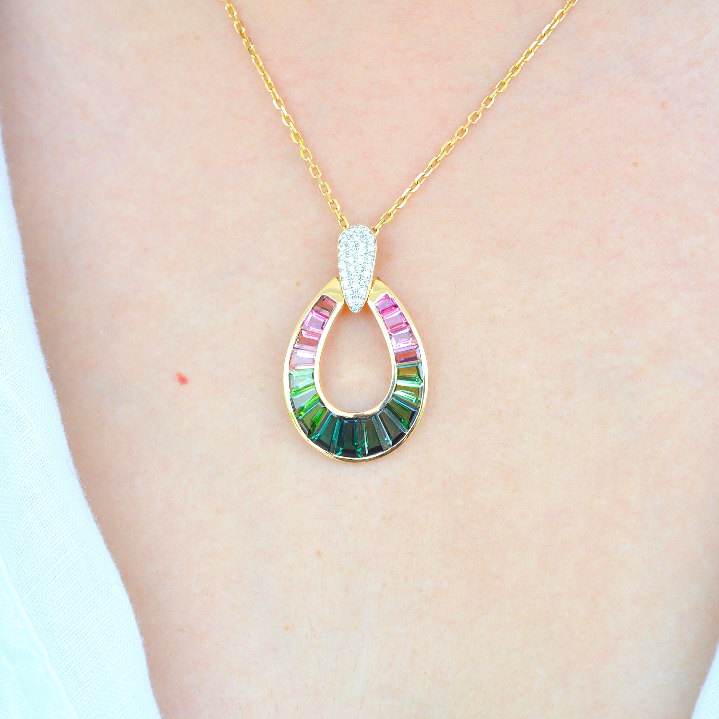 18 karat gold taper baguette green tourmaline and pink tourmaline raindrop diamond pendant necklace

Watermelon tourmalines are exotic, always. Inspired by it's colours, this pendant features lustrous green and pink tourmalines, meticulously picked