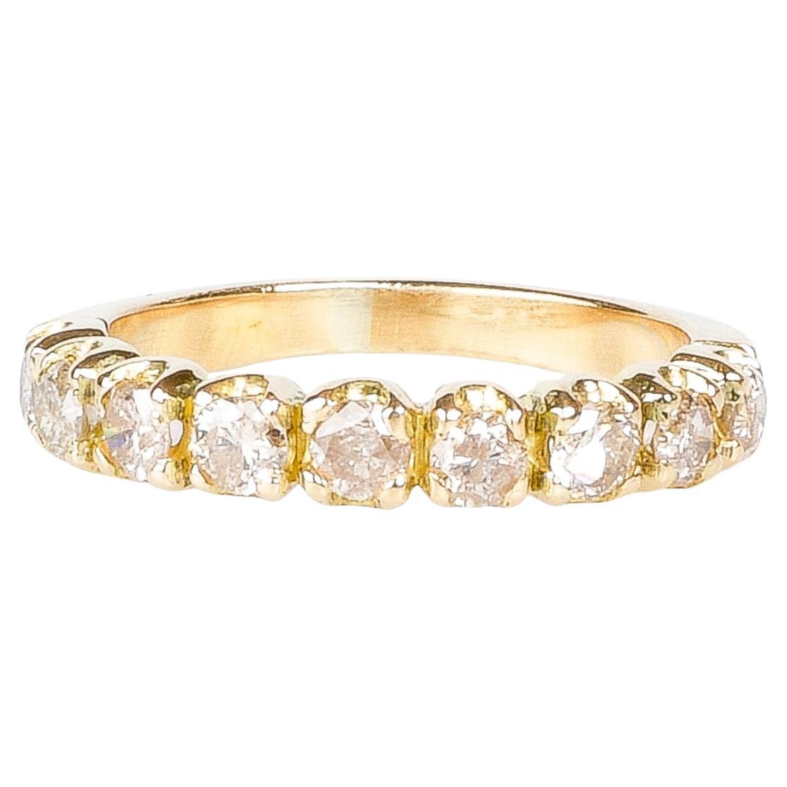  18k gold wedding ring adorned with nine beautiful diamonds For Sale