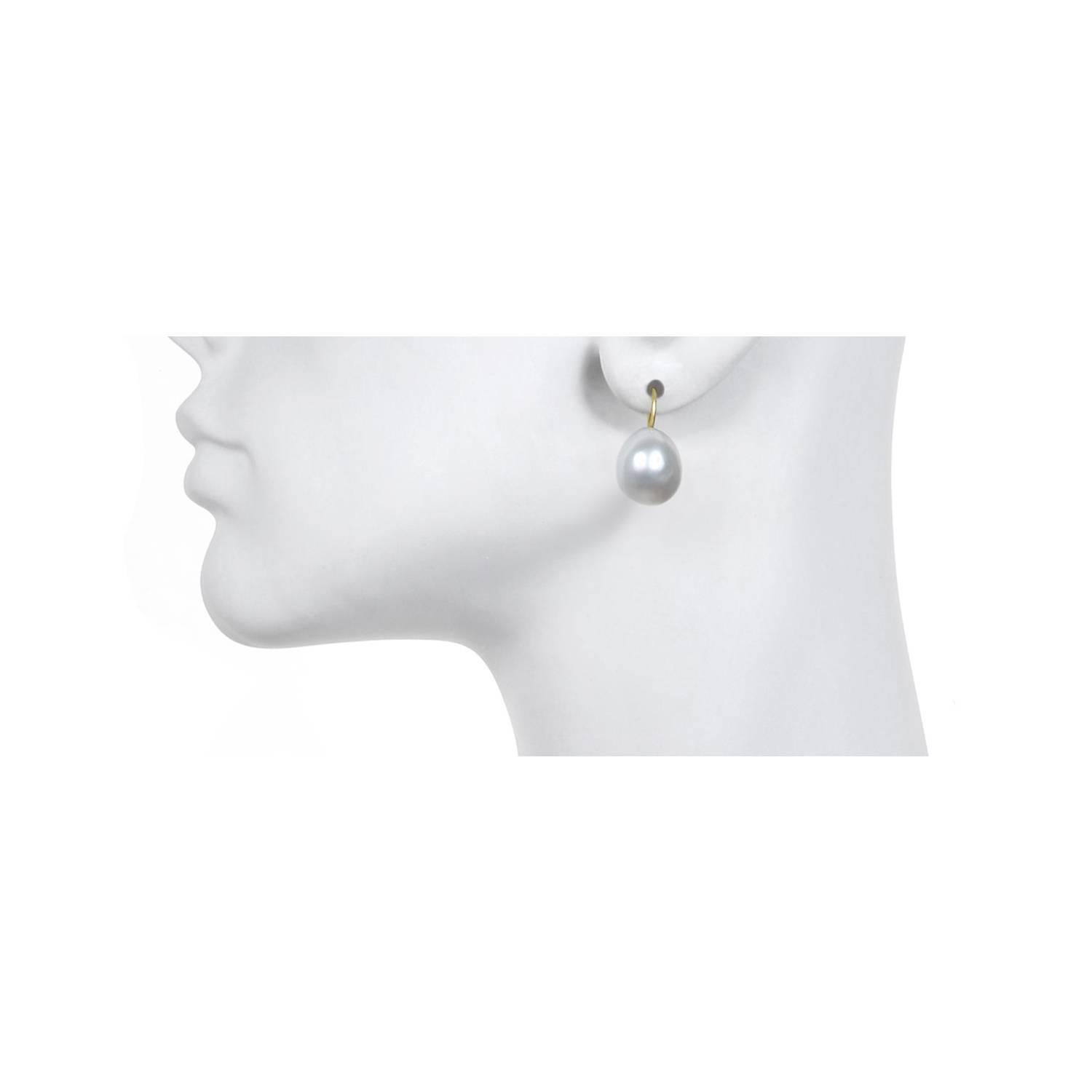 Classic, timeless and simply chic - baroque pearl drops are finished with 18k gold ear wires.  
Each pair of pearl earrings will vary slightly in shape and color due to their organic nature.

Color: White bodycolor with rose overtones
Skin: Very
