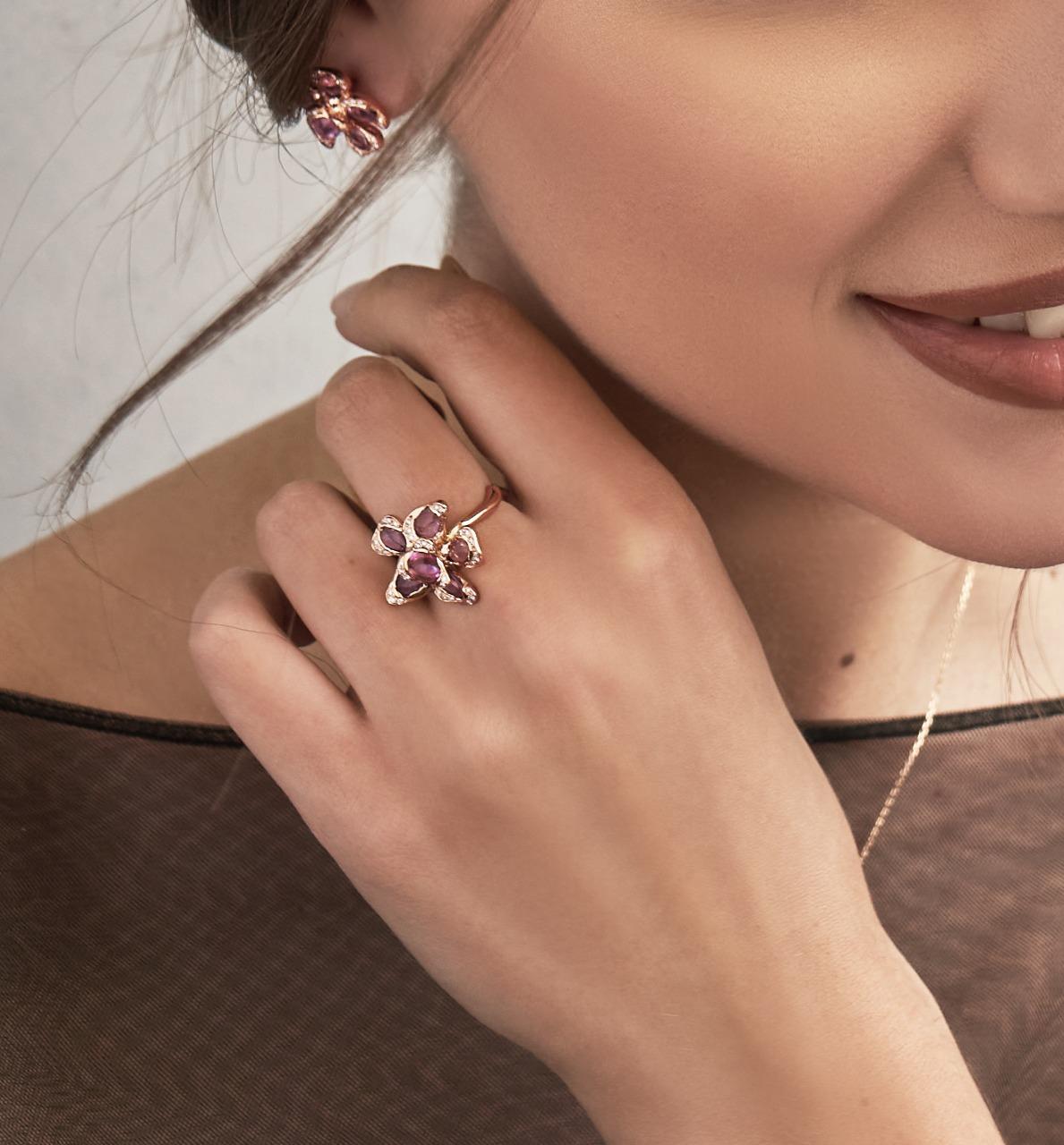 A delicate masterpiece of craftsmanship, this rose Gold Petal earrings embodies elegance and femininity. Designed with an organic, sculptural form, these earrings   features a stunning floral motif at its center, adorned with  pink  sapphires that