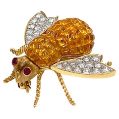 Épingle abeille en or 18 carats avec saphir jaune et saphir