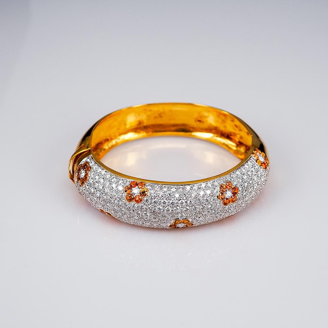 The elegant yellow sapphire and diamond bangle which compose of yellow sapphire 4.50 ct and diamond 8.75 ct H VS quality.It is very elegant for party and cocktail time.The diamond bangle is setting stone in very neat detail.You can see the beauty of