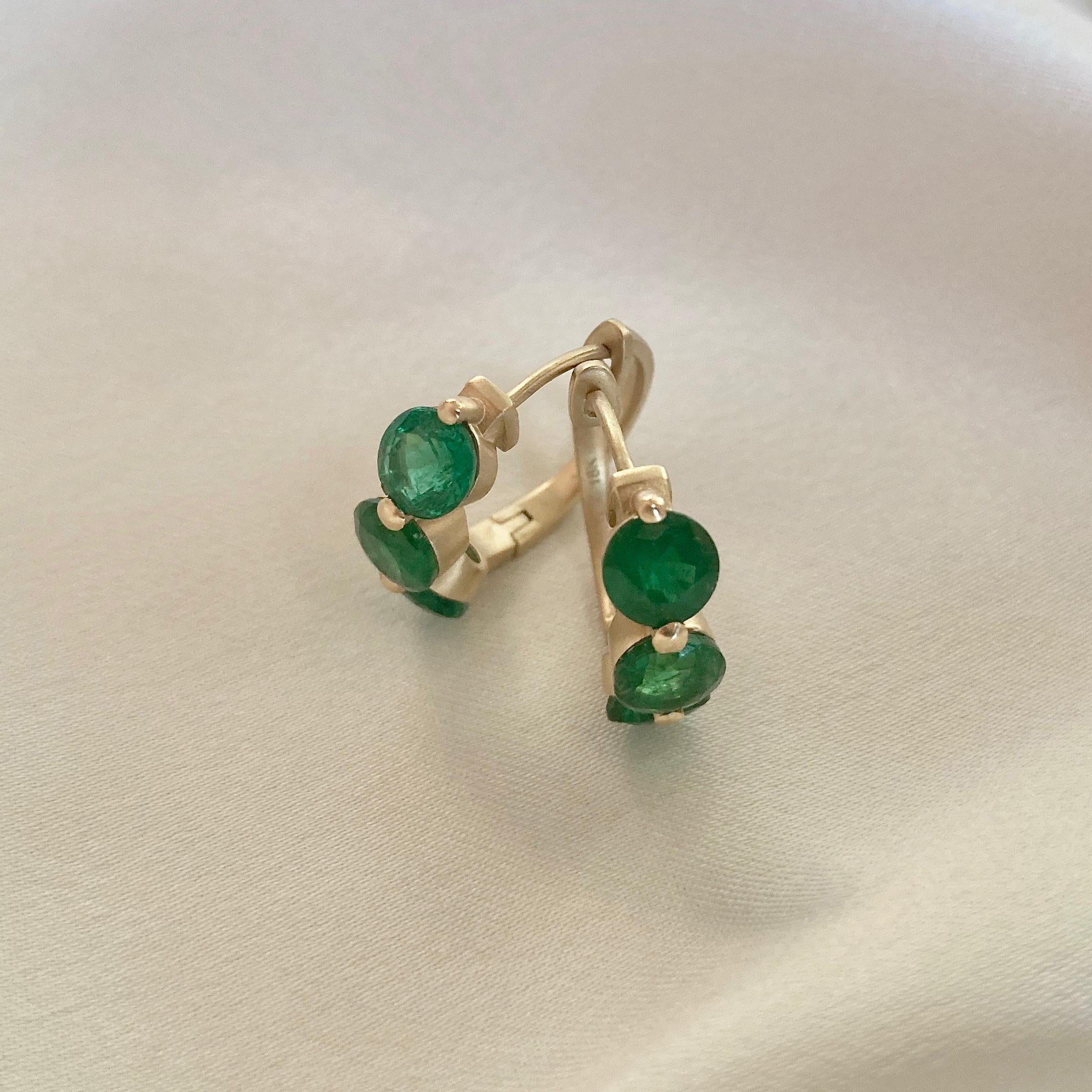 Nancy has done it again.  Wearable luxury at a modest price point and with Emeralds!  These huggy style earrings are light weight, fit close to the ear and showcase 2.92 carats of beautiful, very fine quality Emeralds.  Since there are no diamonds,