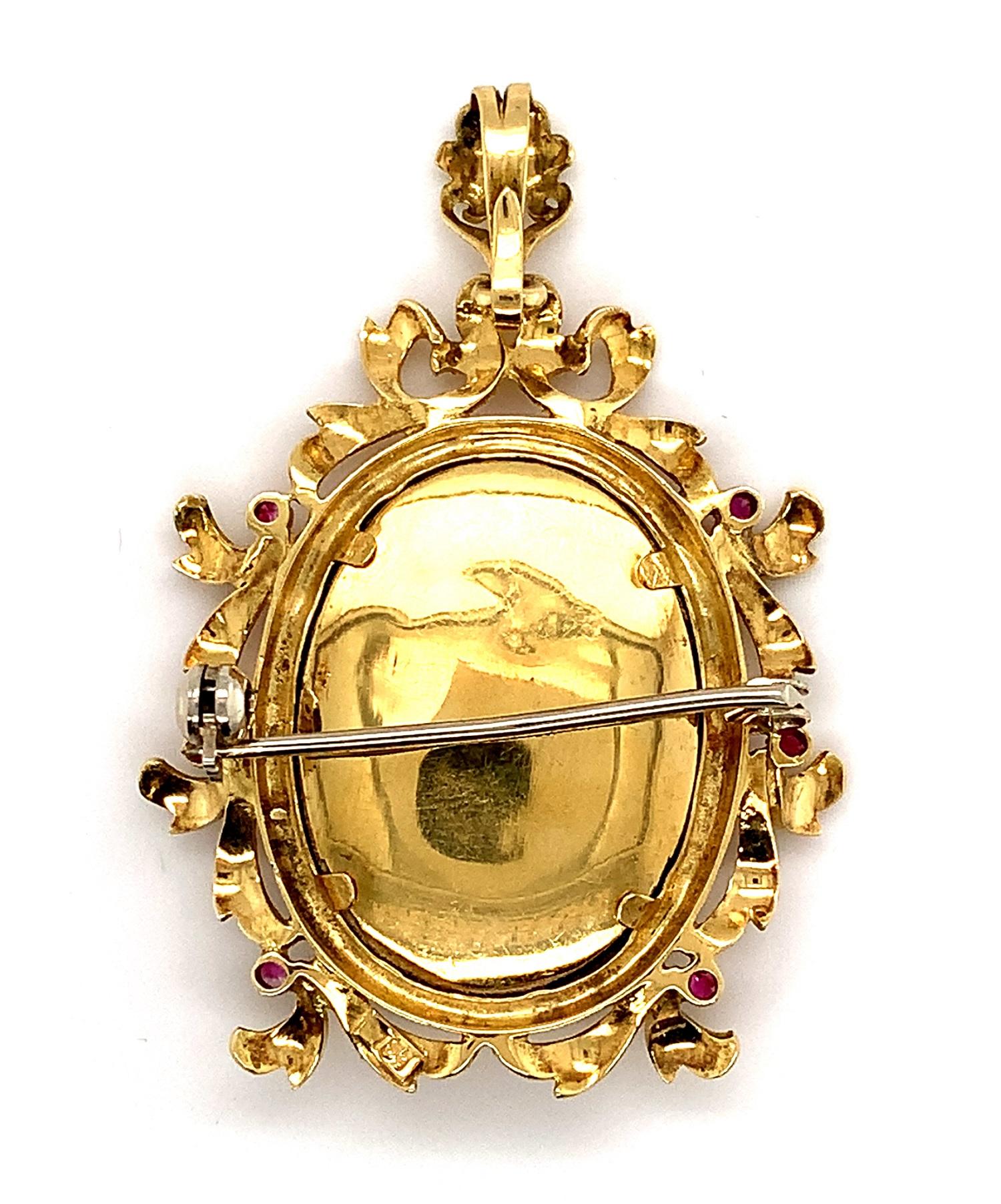 Italian 18k yellow gold hand painted portrait pin or pendant. It features a beautiful oval hand painted portrait based on the Mona Lisa, which is accented with a tiny emerald and 2 small round diamonds. The portrait measures about 1