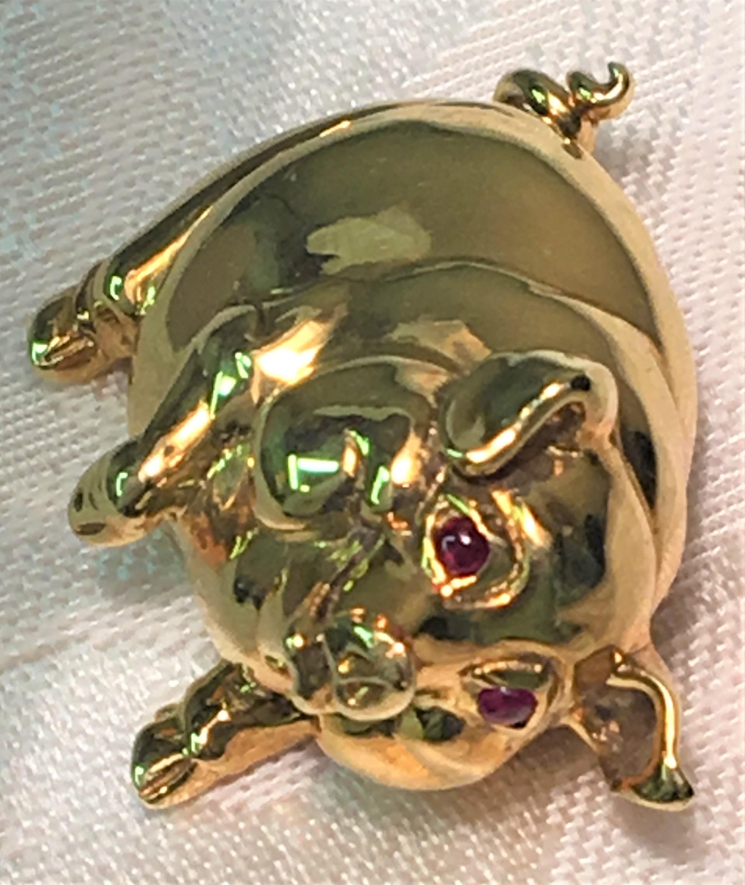 This happy dancing pig will make everyone smile! 
18 karat yellow gold pig
Two cabochon ruby eyes
Hinged pin with safety
Stamped 