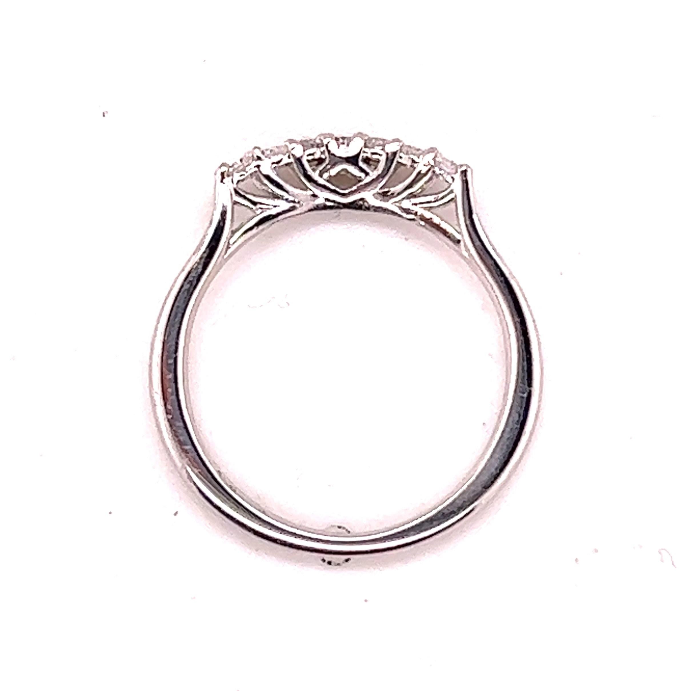 18kt white gold Hearts on Fire curved band. The band contains 7 round brilliant diamonds weighing approximately .14 carats. The diamonds possess an average of H-I color and SI1-SI2 clarity as stated by Hearts on Fire. 

The band measures 1.21mm x