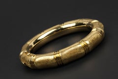 18 Karat Hinged Bangle with Florentine Finish