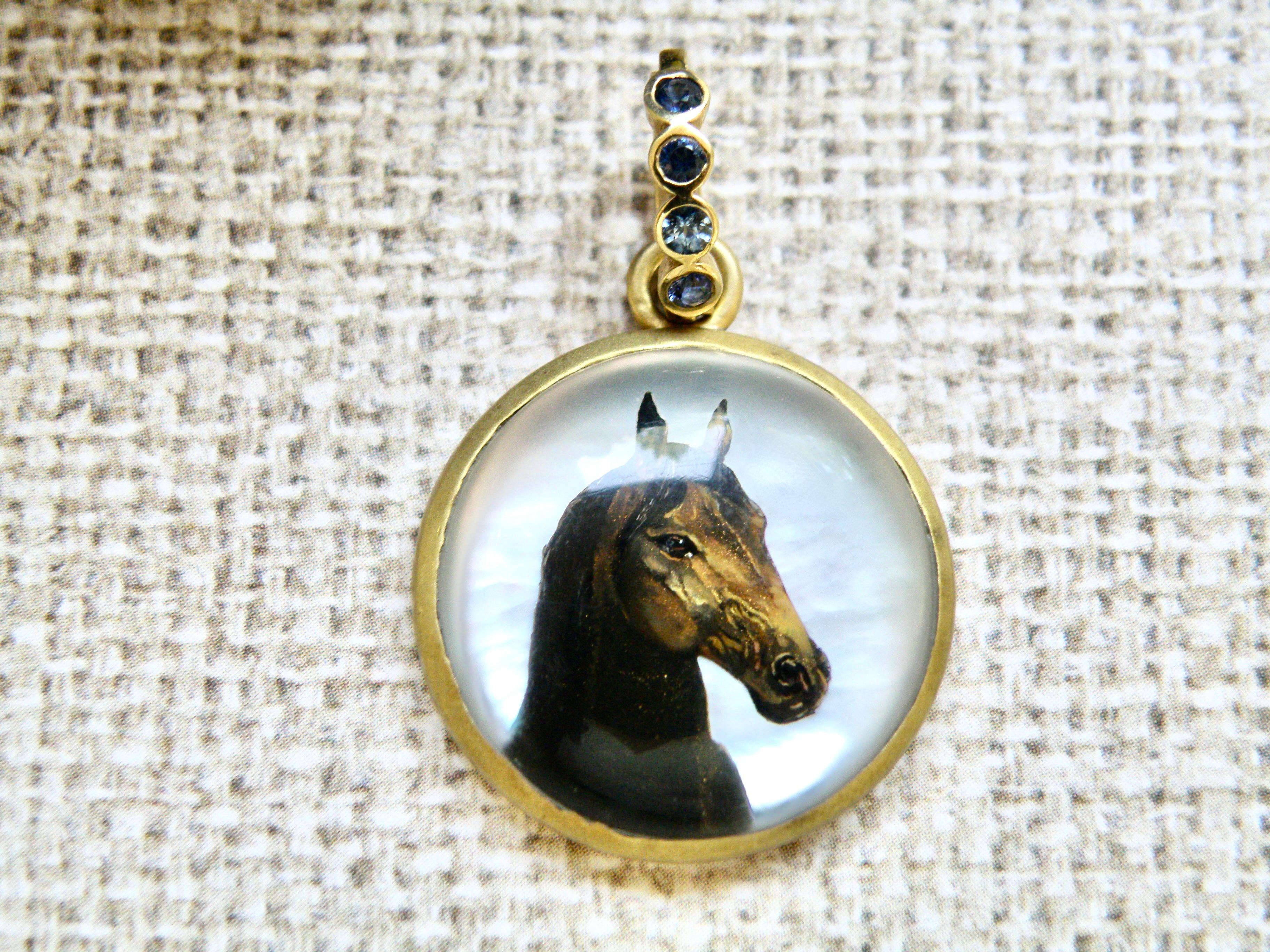 18K hand painted reverse crystal horse backed with mother of pearl on sapphire detachable bail