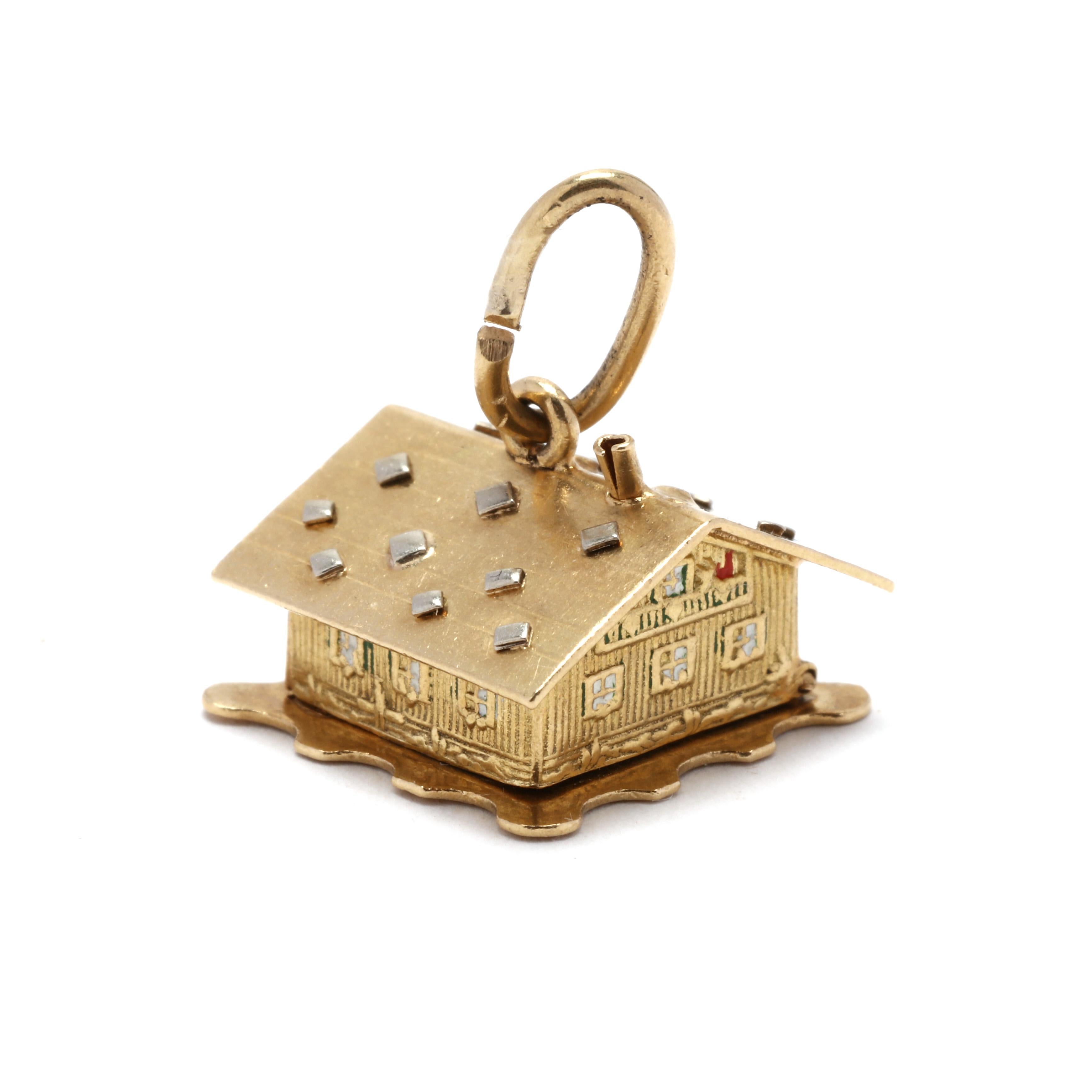 A vintage 18 karat yellow gold house with enamel people charm. This charm features winter cabin motif with engraved detailing and the top opens up to reveal a couple in bed with enamel detailing.



Length: 1/2 in.



Width: 1/2 in.



Weight: 2.6