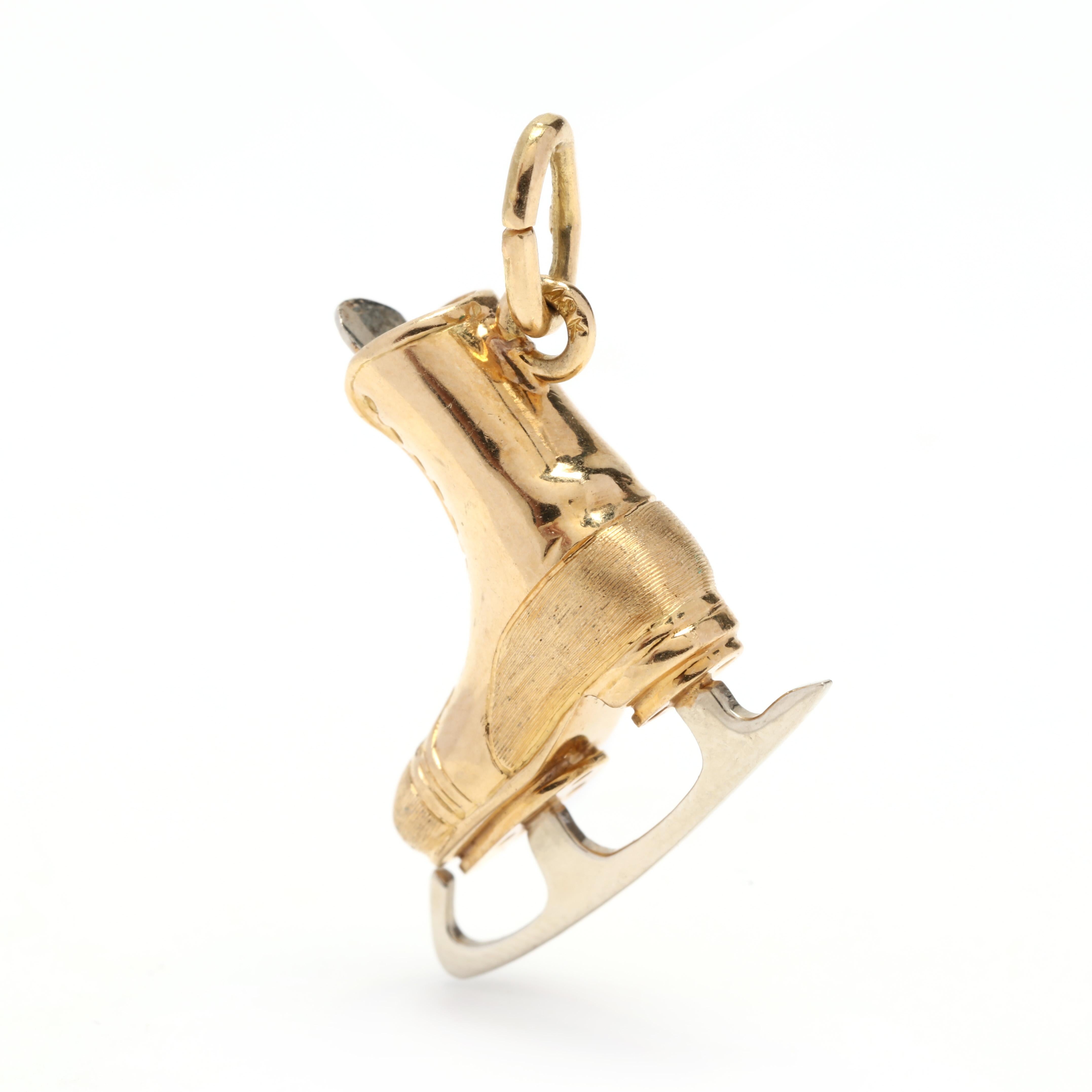 A vintage 18 karat bicolor gold ice skate charm. This 3 dimensional charm features a yellow gold shoe with a white gold blade and shoe tongue and with a thin oval bail.



Length: 3/4 in.



Width: 3/4 in.



Weight: 2.1 dwts.