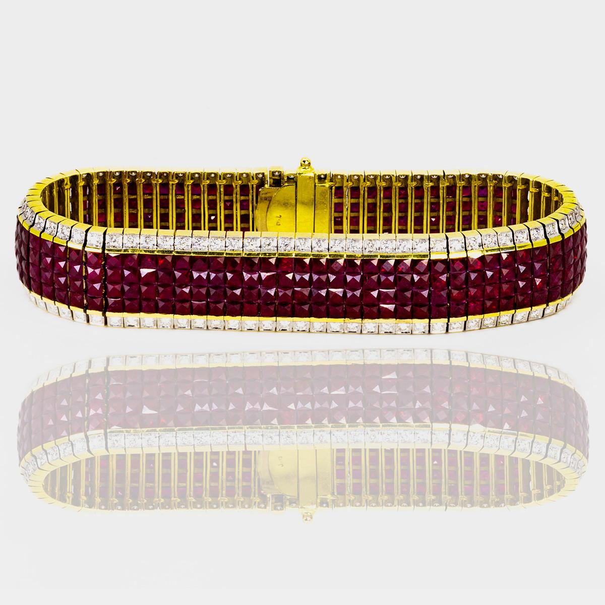 Gorgeous 18k Bracelet set with 312 Invisible set fine rubies weighing approximately 25.00 carats and 156 round fine white diamonds weighing approximately 3.00 carats. 7 1/2