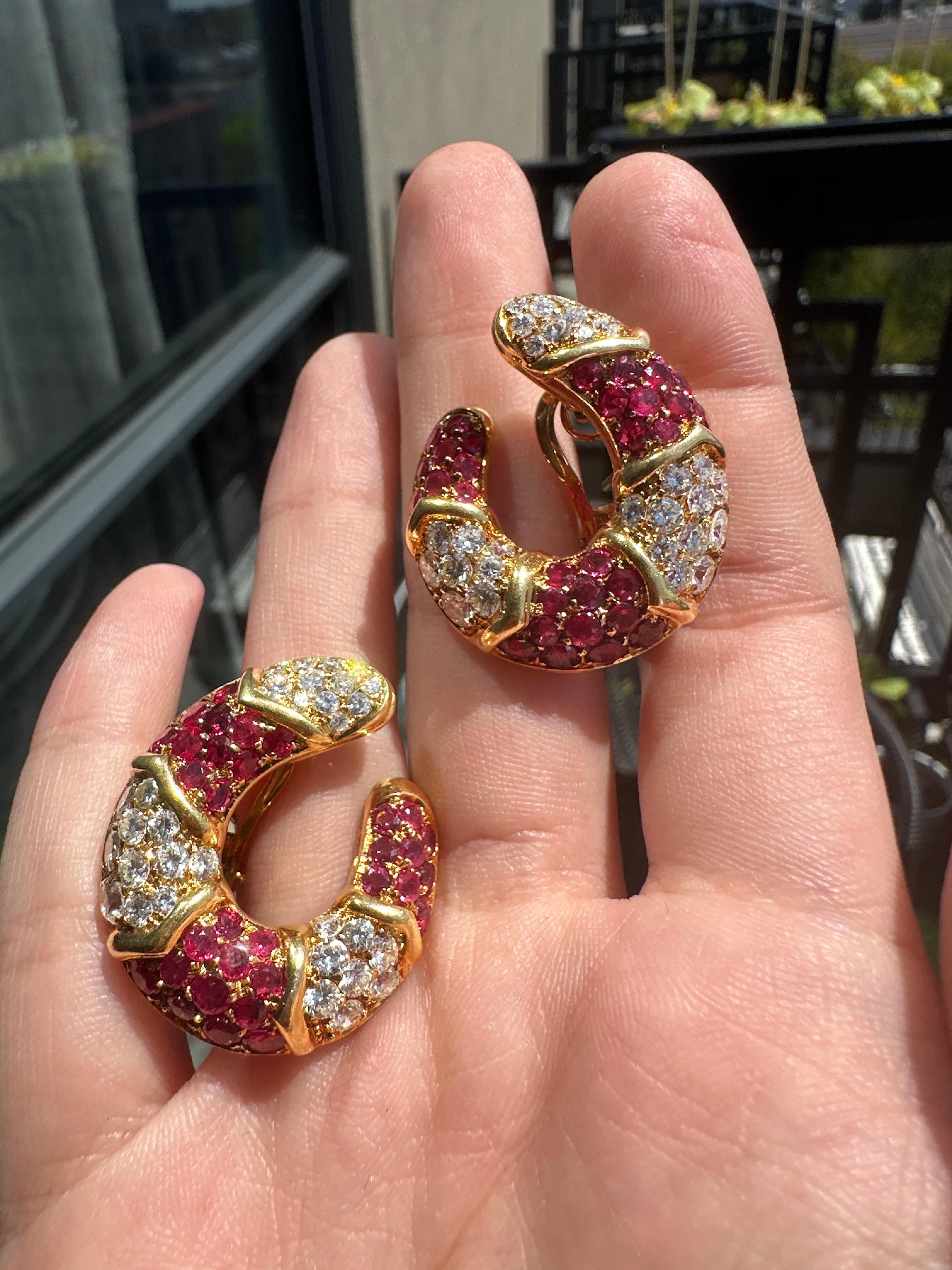 Add a touch of vintage glamour to your look with our 18k Italian Made Estate Diamond and Ruby Earrings! Crafted in the1960's, these earrings feature a stunning combination of 4.50 carats of diamonds and rubies set in 18k yellow gold. With a length