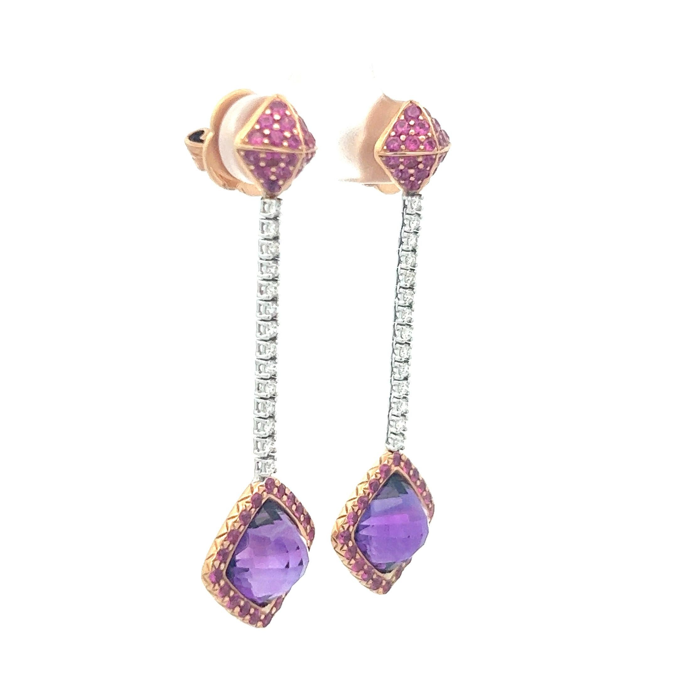 A remarkable pair of 18k rose gold earrings featuring fancy cut amethyst, rubies, and diamonds by designer Richard Krementz. Krementz founded his jewelry business in 1866 after immigrating from Germany. He was one of the first to travel to Myanmar,