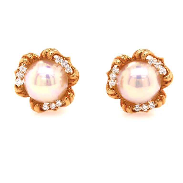 Kurt Wayne Pearl Diamond Earrings in 18K Yellow Gold.  Round Brilliant Cut Diamonds weighing 1.26 carat total weight, G-H in color and VS in clarity are expertly set around the White Round Pearls.  The Earrings measure 7/8 inch in length and 1 inch