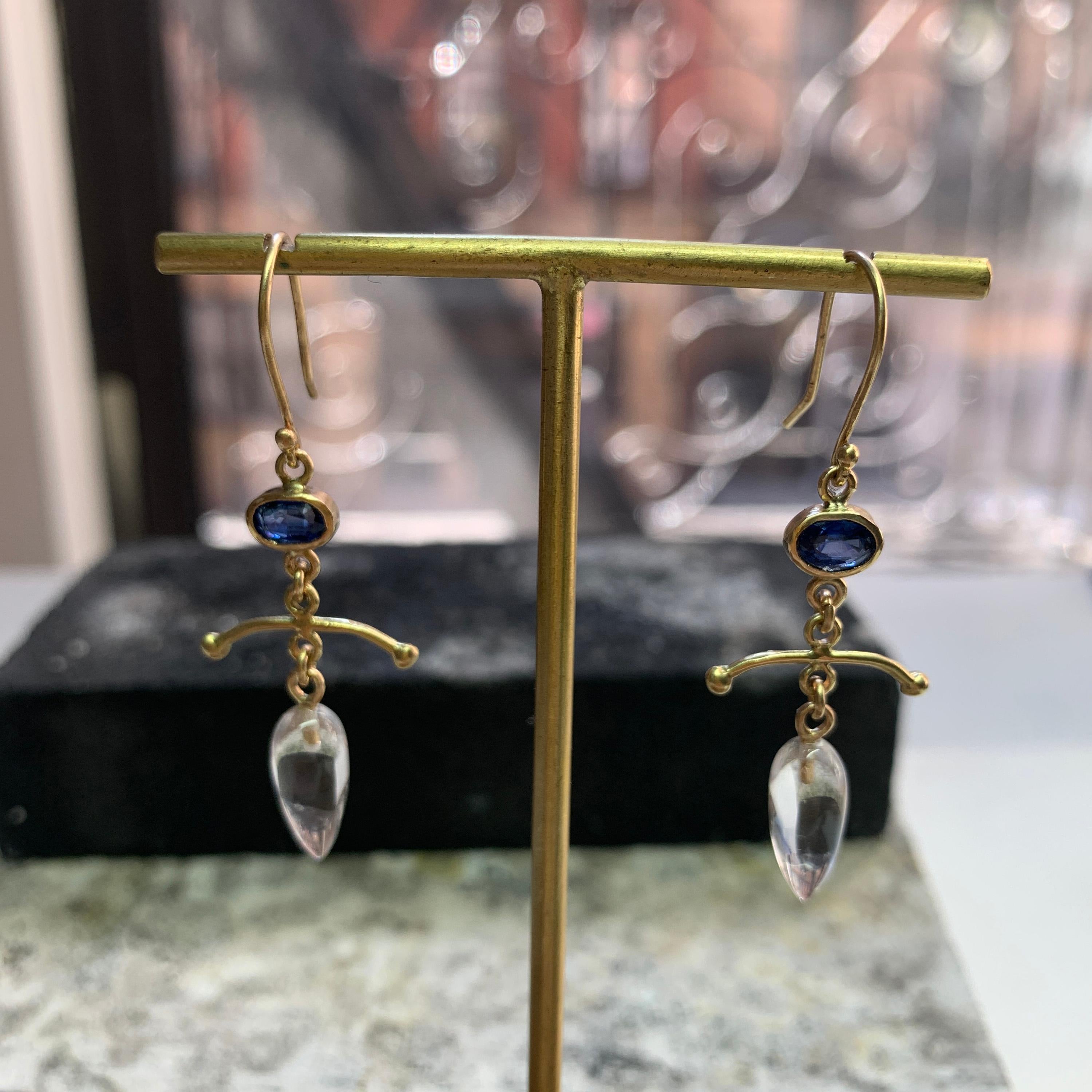 Faceted Blue Kyanite Ovals compliment the smooth rock crystal drops in this 18K gold hand fabricated pair of earrings.  One of a kind.