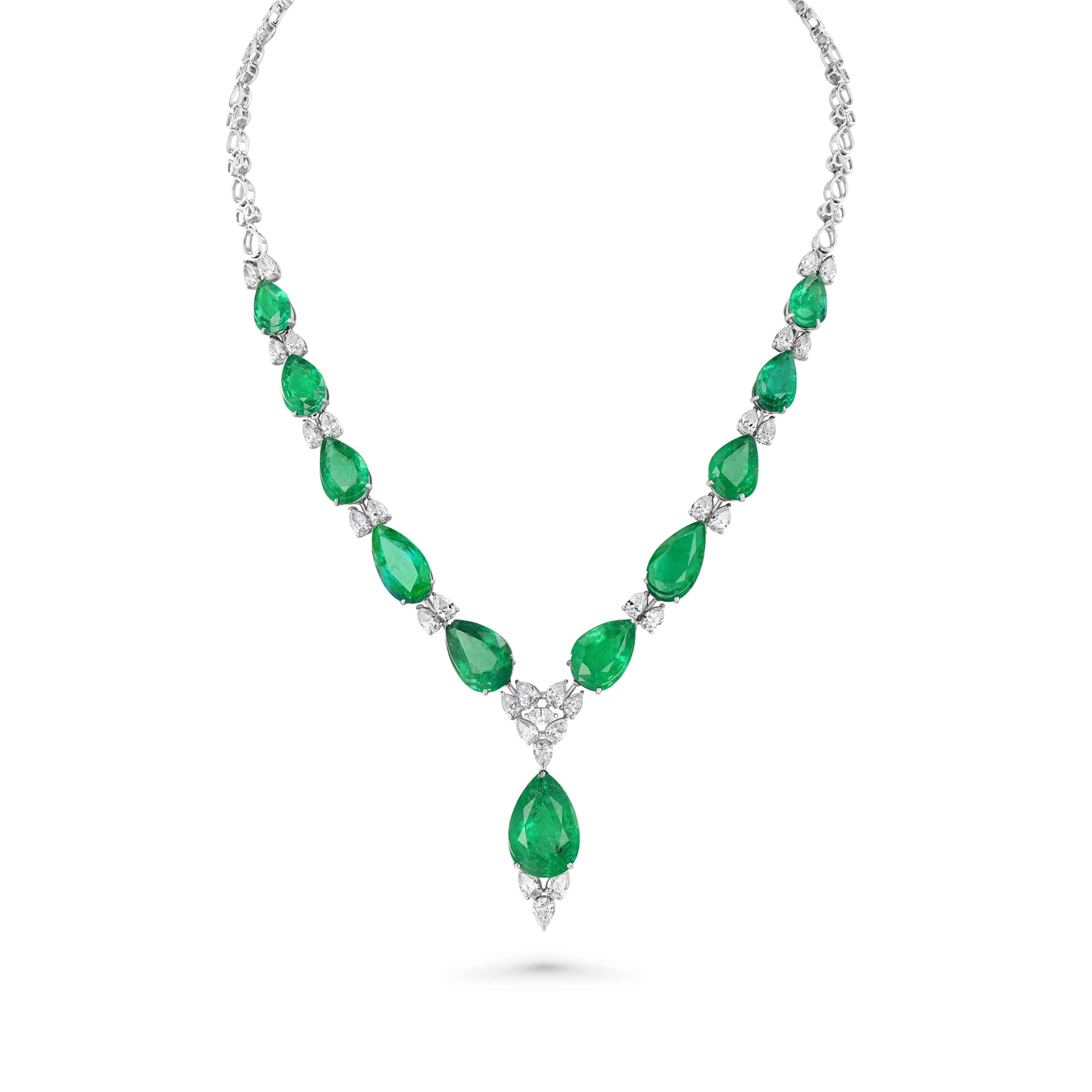 Item #8144

18K White Gold Ladies Chandelier Necklace with 35.90ct Emerald and 5.85ct Diamond.
Pear brilliant cut natural Emerald Beryl Gemstone are mounted in the center of the necklace with near colorless Marquise brilliant and numerous near