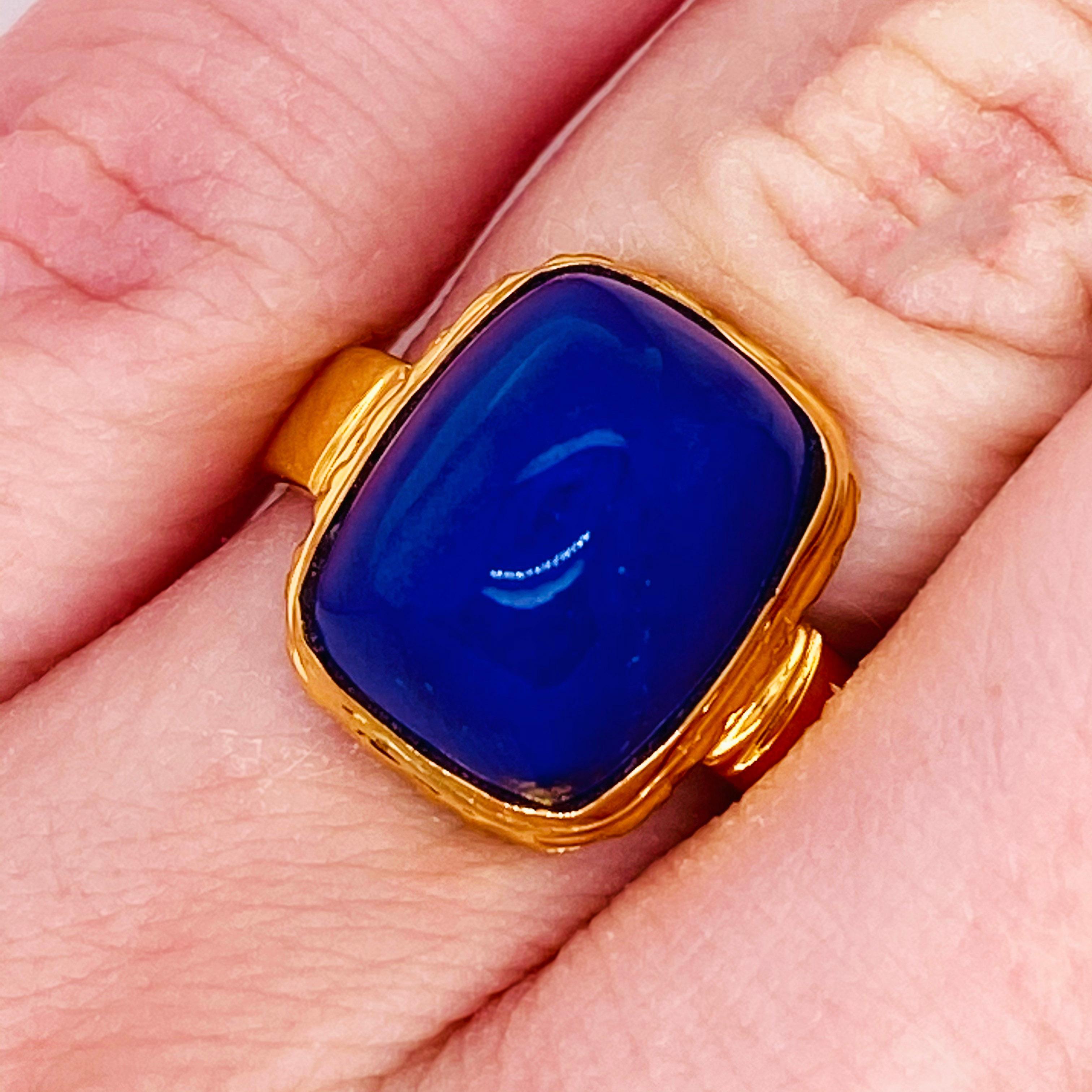 This stunningly beautiful blue lapis ring in 18kt yellow gold would make anyone thrilled to receive it! This ring provides a huge statement look that is very modern and classic at the same time! This ring is very fashionable and can add a touch of