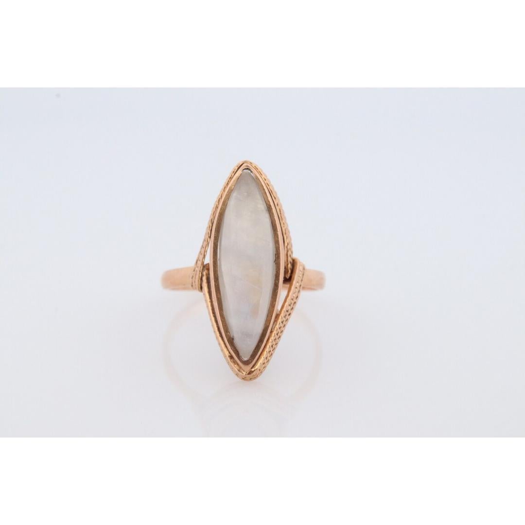 Vintage from the 1950s
Size: 6 US
Materials: Gold
Gemstone: Moonstone
Band Color: Gold

Style: Victorian

Amazing MOONSTONE. Marquise shape set into 18k Gold.

Condition: Shows some signs of wear.

Details:
18mm by 5mm moonstone
8mm rise off