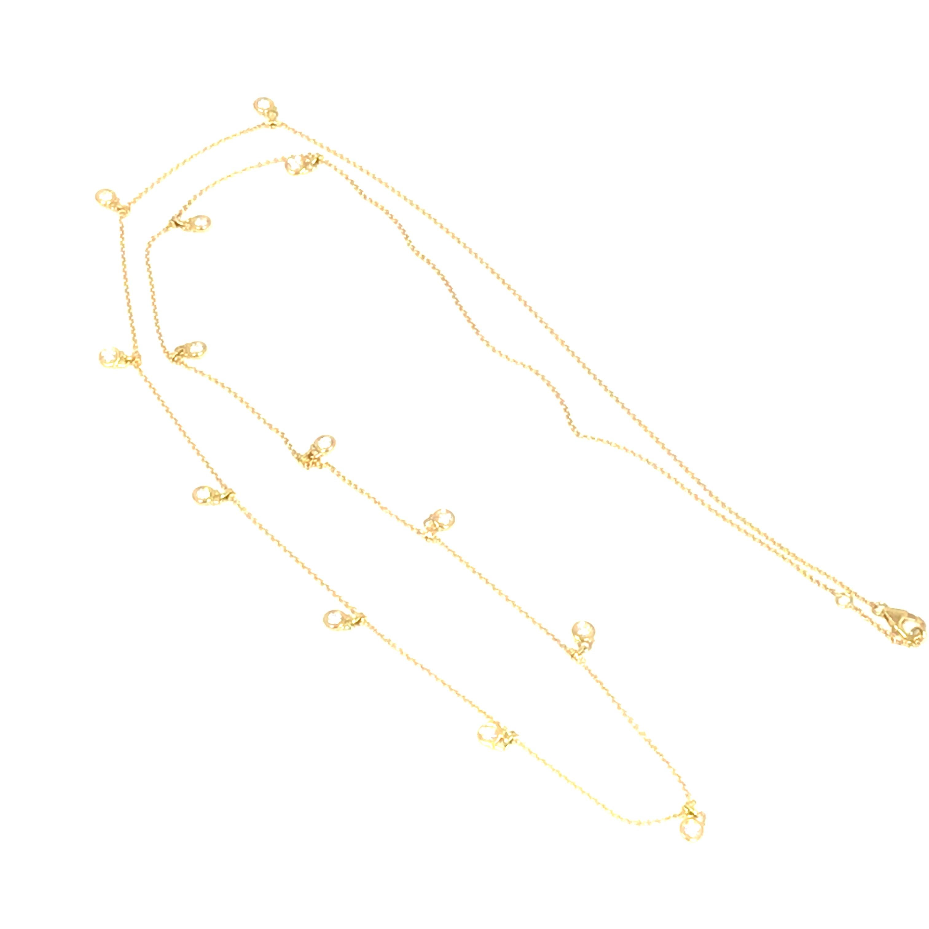 Long 36 inch Diamond-by-the-Yard Necklace with Dangles in 18K Yellow Gold.  (13) Round Brilliant Cut Diamonds weighing 1.25 carat total weight, G-H in color and VS-SI in clarity are bezel set in dangles along the chain.  Each dangle measures 3/8