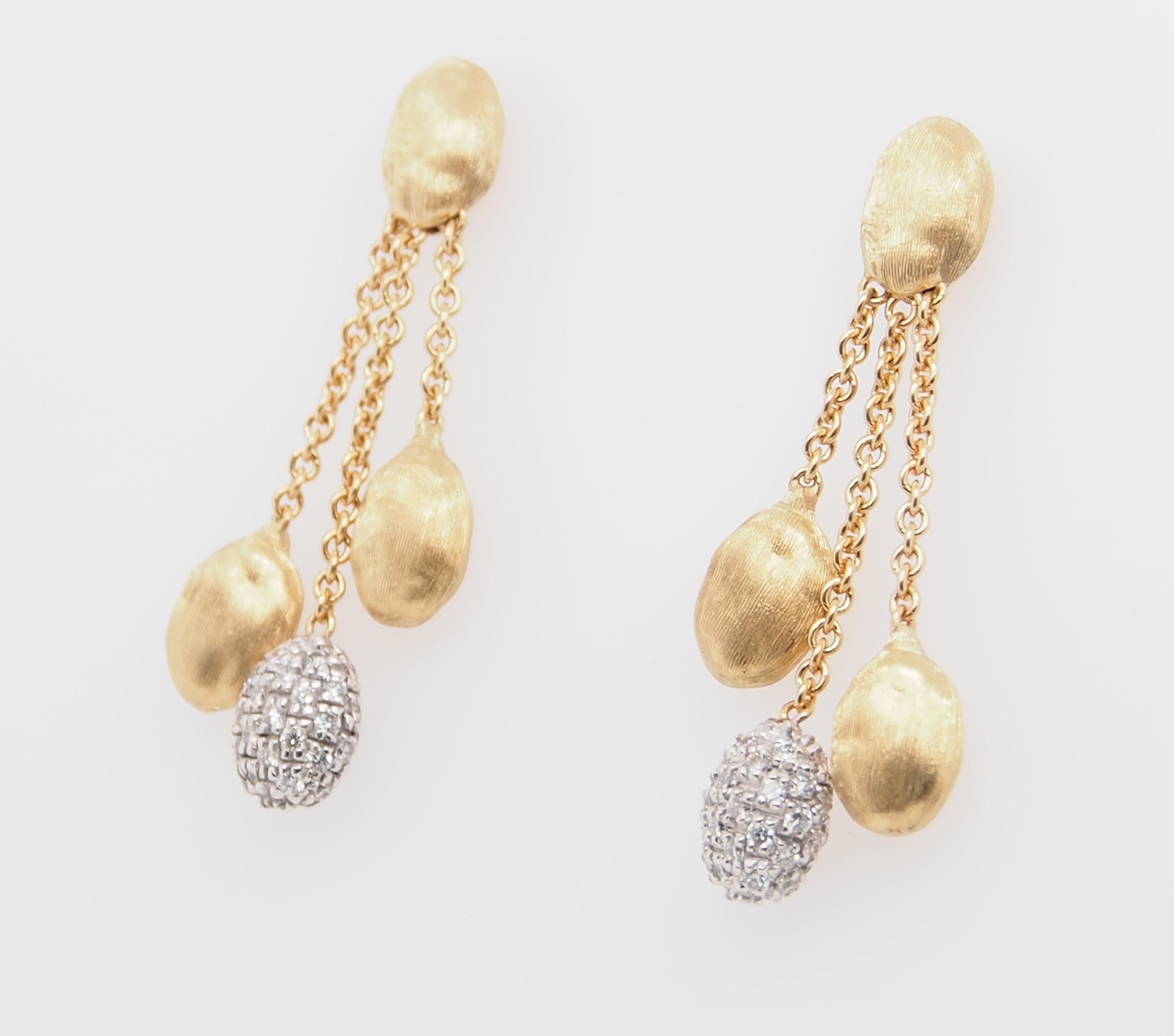 A classic from Marco Bicego Siviglia Collection 18K yellow gold Three Strand Earrings with a Diamond pave ball. (84) Round Brilliant Cut diamonds are pave set .63 carat total weight G-H in color VS in clarity. The earrings weigh 6.2 grams are 1 1/4