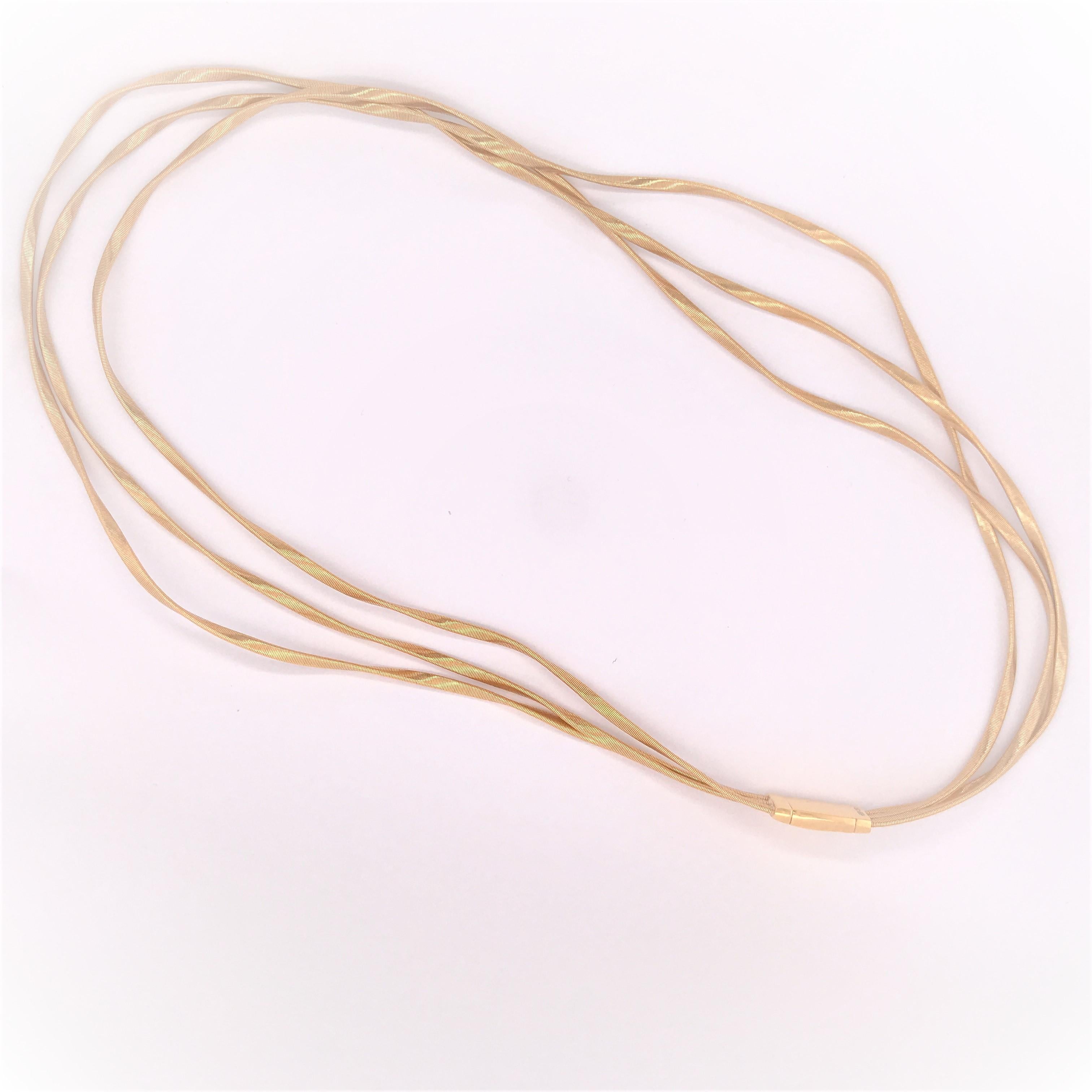 Marco Bicego necklace from the Marrakech Collection in 18K Yellow Gold. Three twisted strands. Approximately 16.5 inches in length and 3/8 inch in width. Logo-engraved push clasp. 37.9 grams.